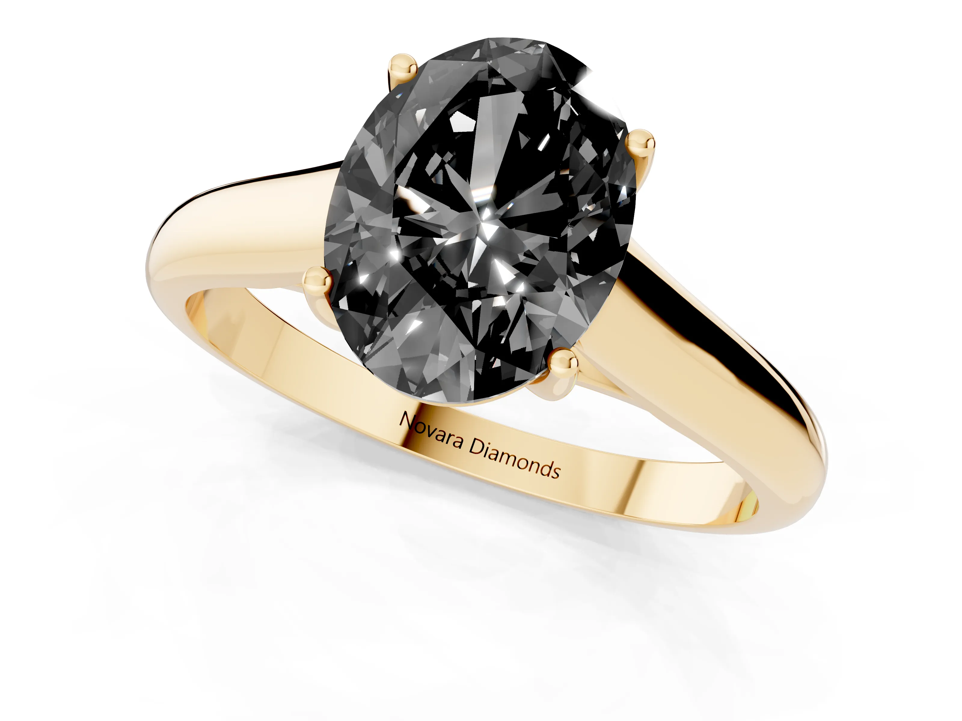 Fancy Black Oval Cut Diamond Solitaire Engagement Ring Set in Yellow gold with Subtly Tapered Band and Prong Setting