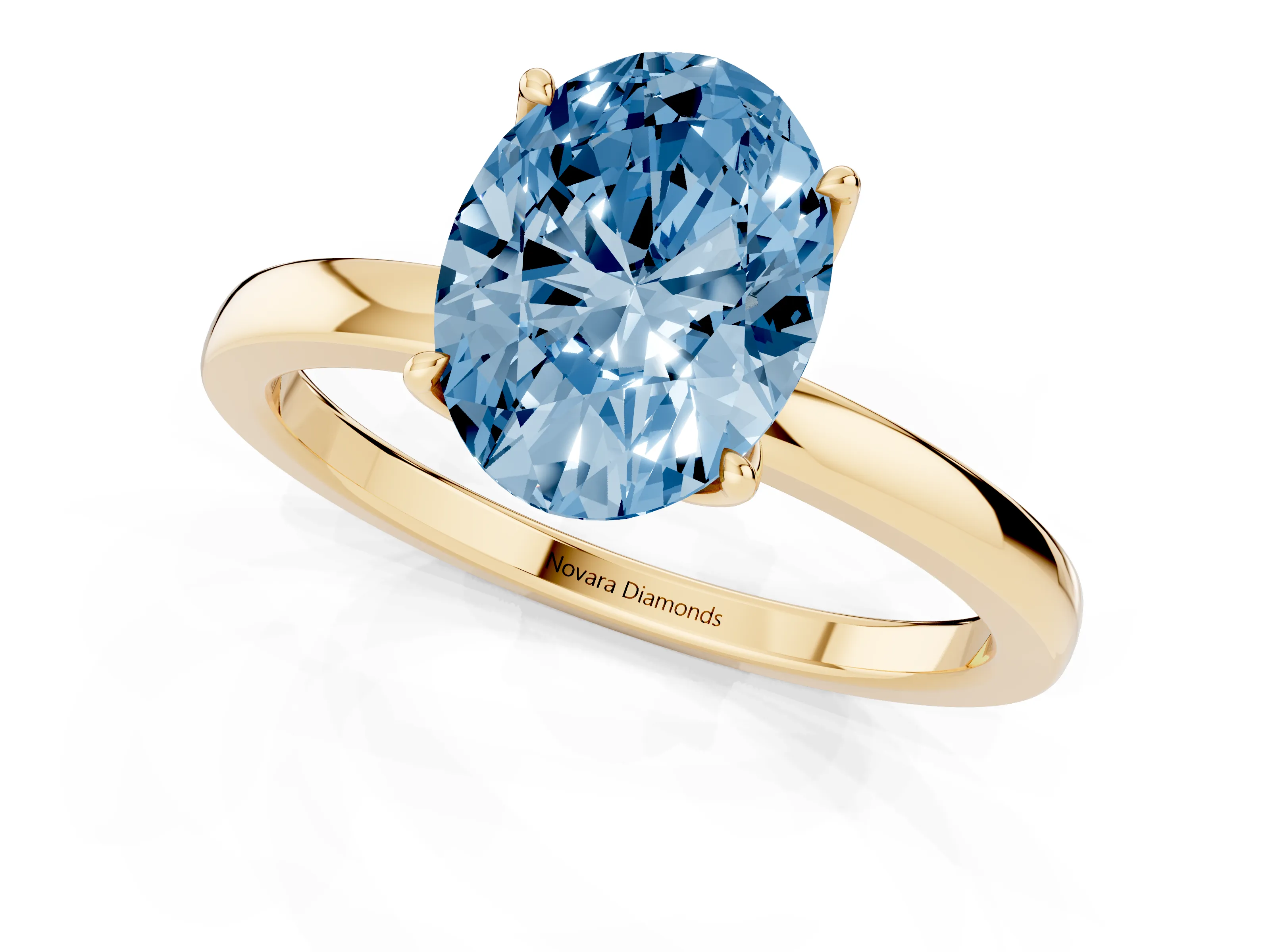 Fancy Blue Oval Cut Diamond Solitaire Ring Set in Yellow gold with Prong Setting and Thin Polished Band