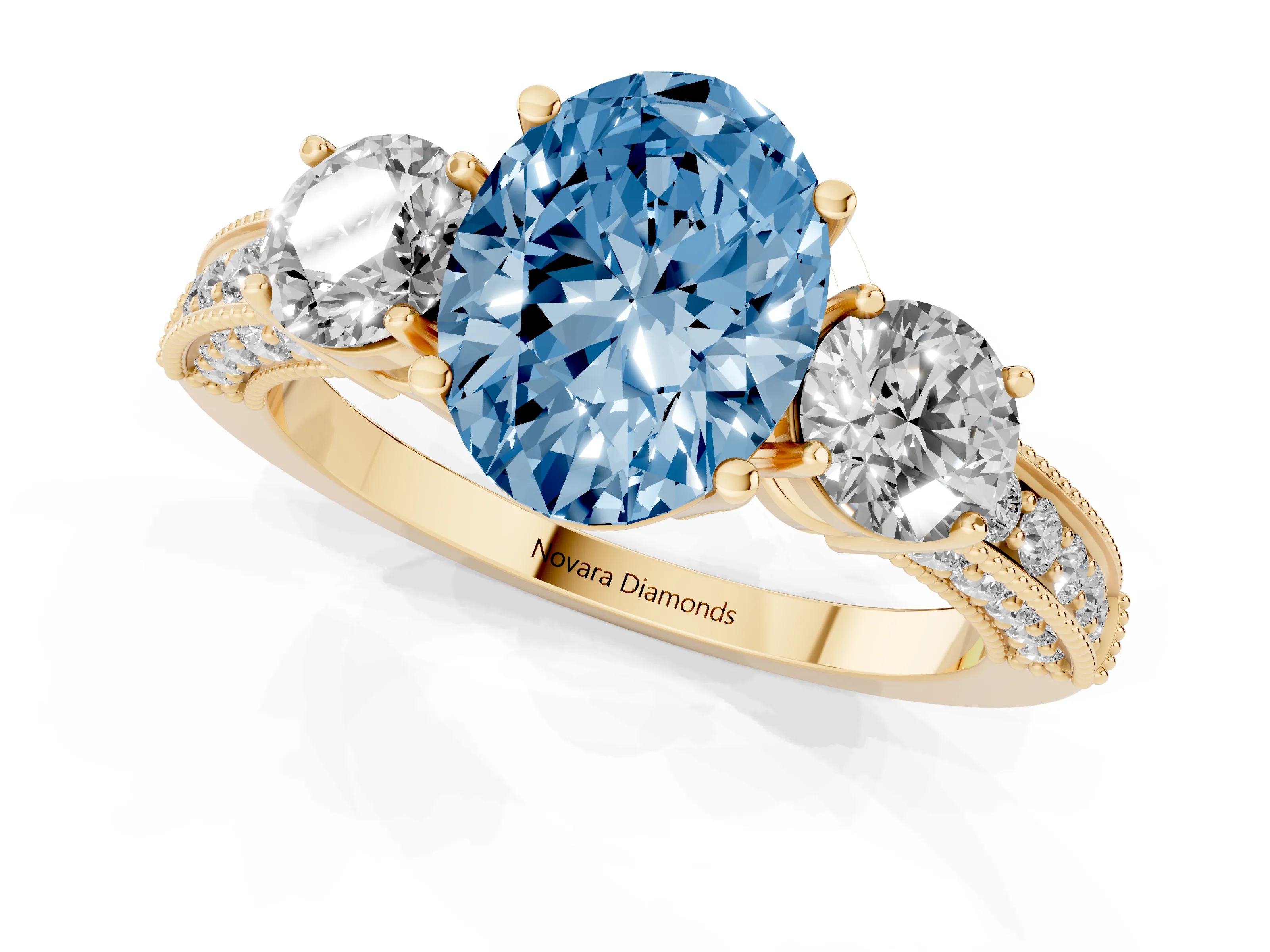 Fancy Blue Oval Cut Diamond Three-Stone Ring Set in Yellow gold with Round Side Stones and Pavé Band
