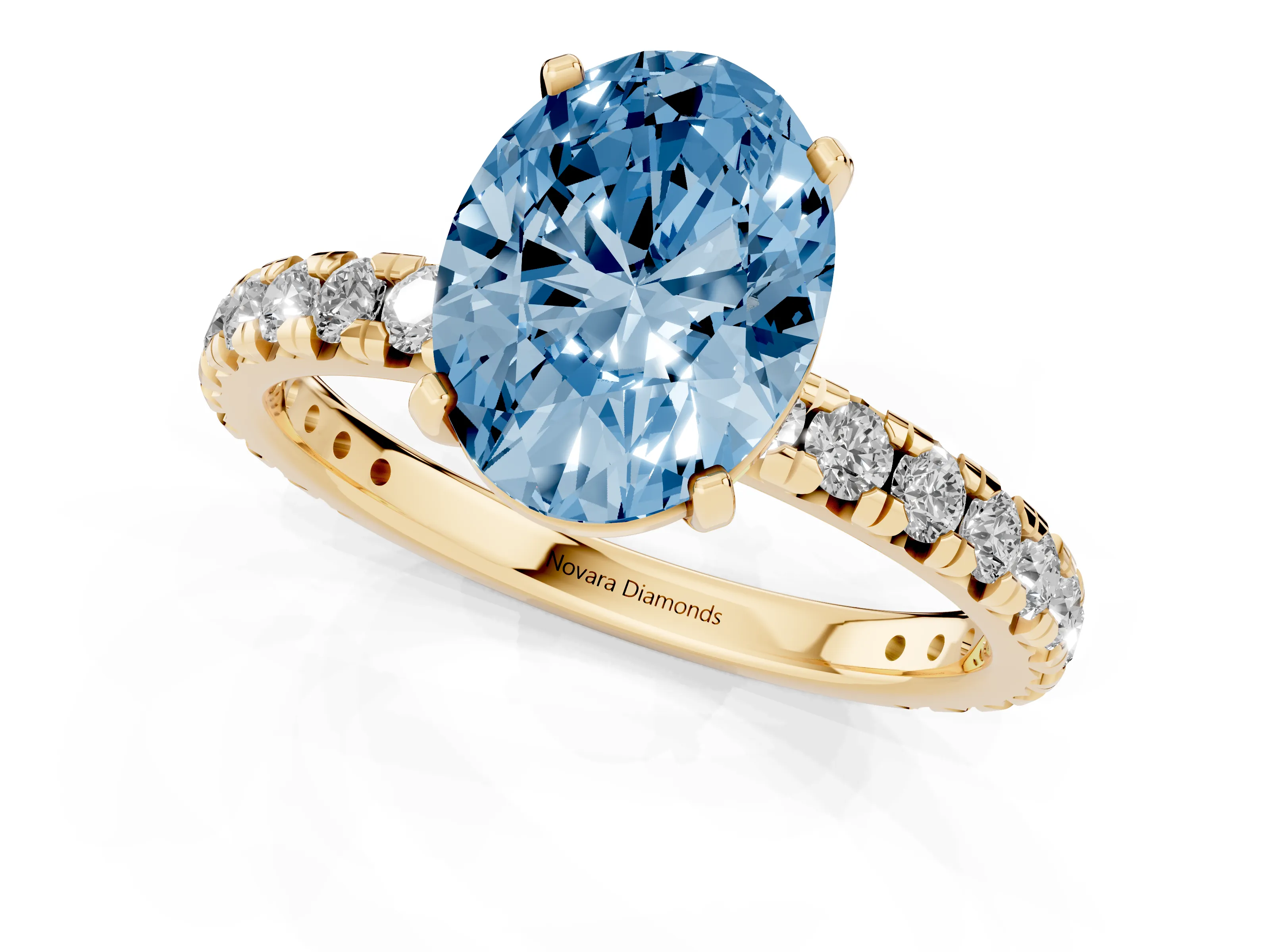 Fancy Blue Oval Cut Diamond Pavé Solitaire Ring Set in Yellow gold with Round Band and Prong Setting