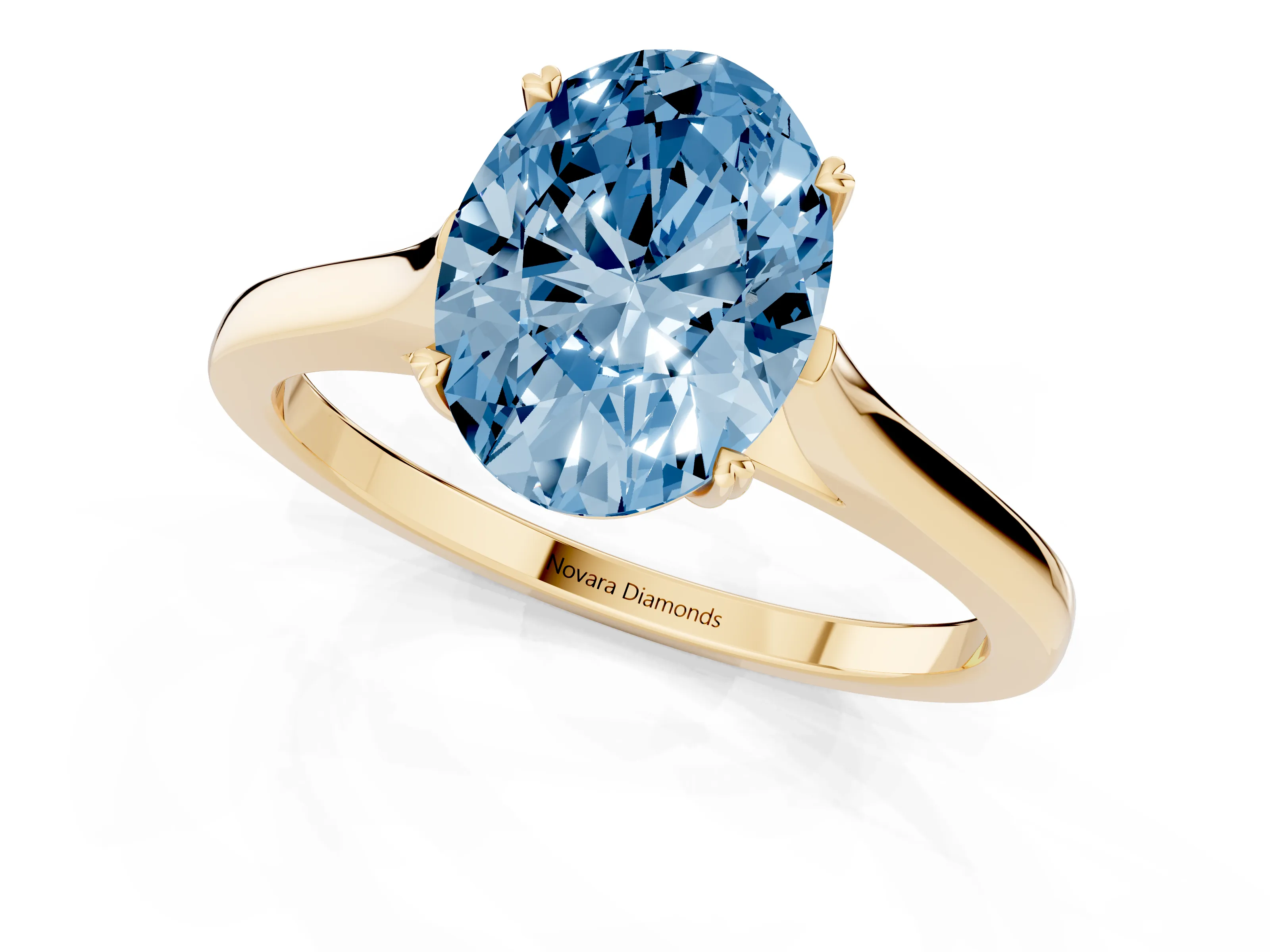Fancy Blue Oval Cut Diamond Solitaire Heart Prong Engagement Ring Set in Yellow gold with Tapered Band