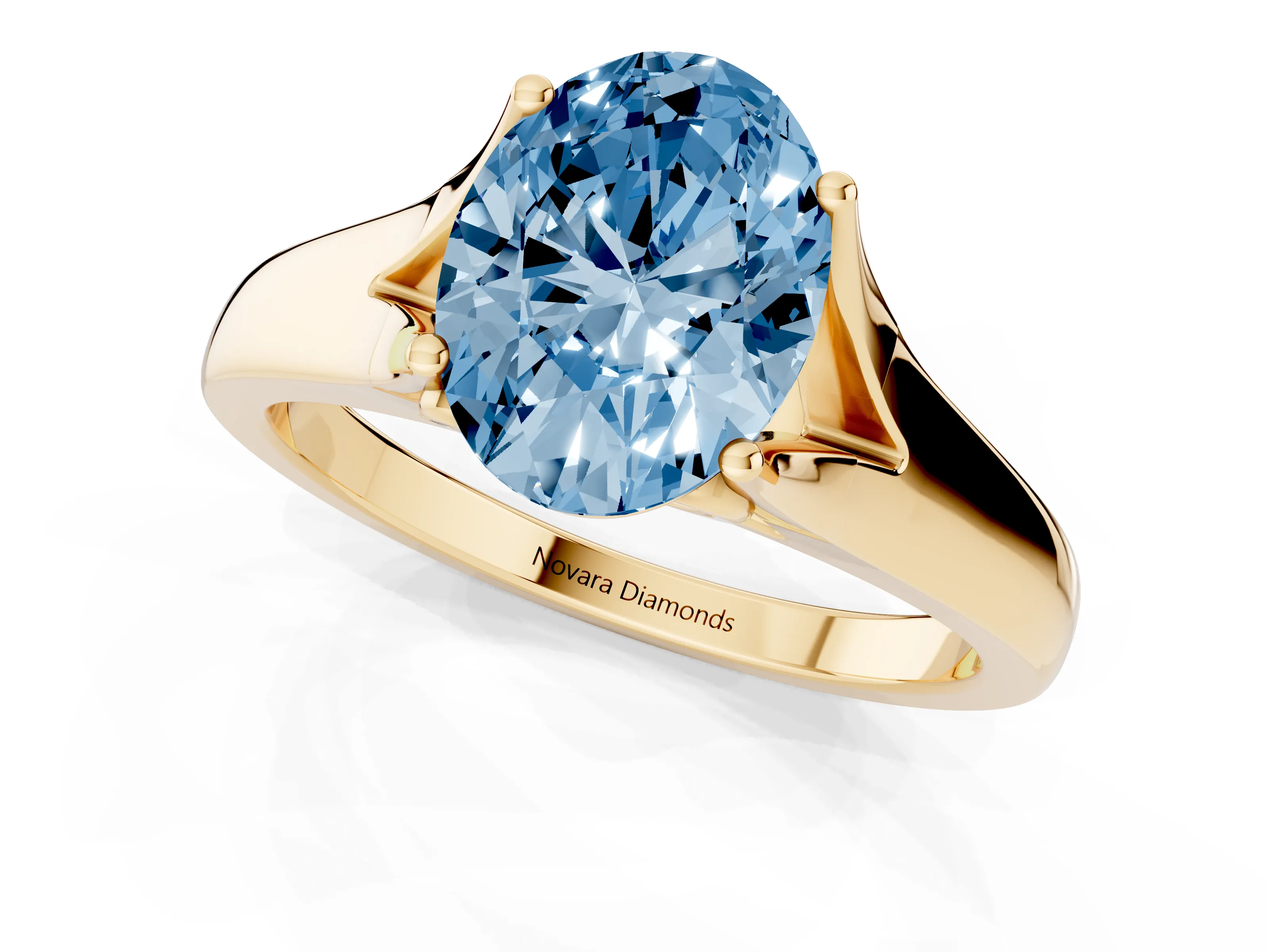 Fancy Blue Oval Cut Diamond Solitaire Ring Set in Yellow gold with Arched Cathedral Band and Prong Setting