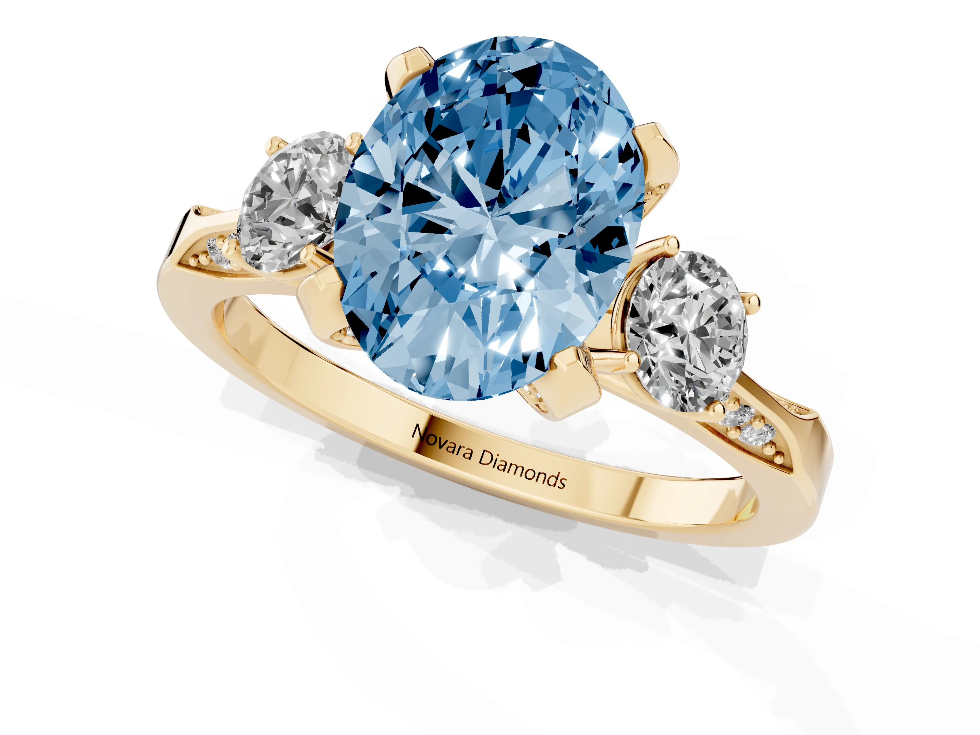 Fancy Blue Oval Cut Diamond Three-Stone Ring Set in Yellow gold with Pavé Band and Smaller Side Stones