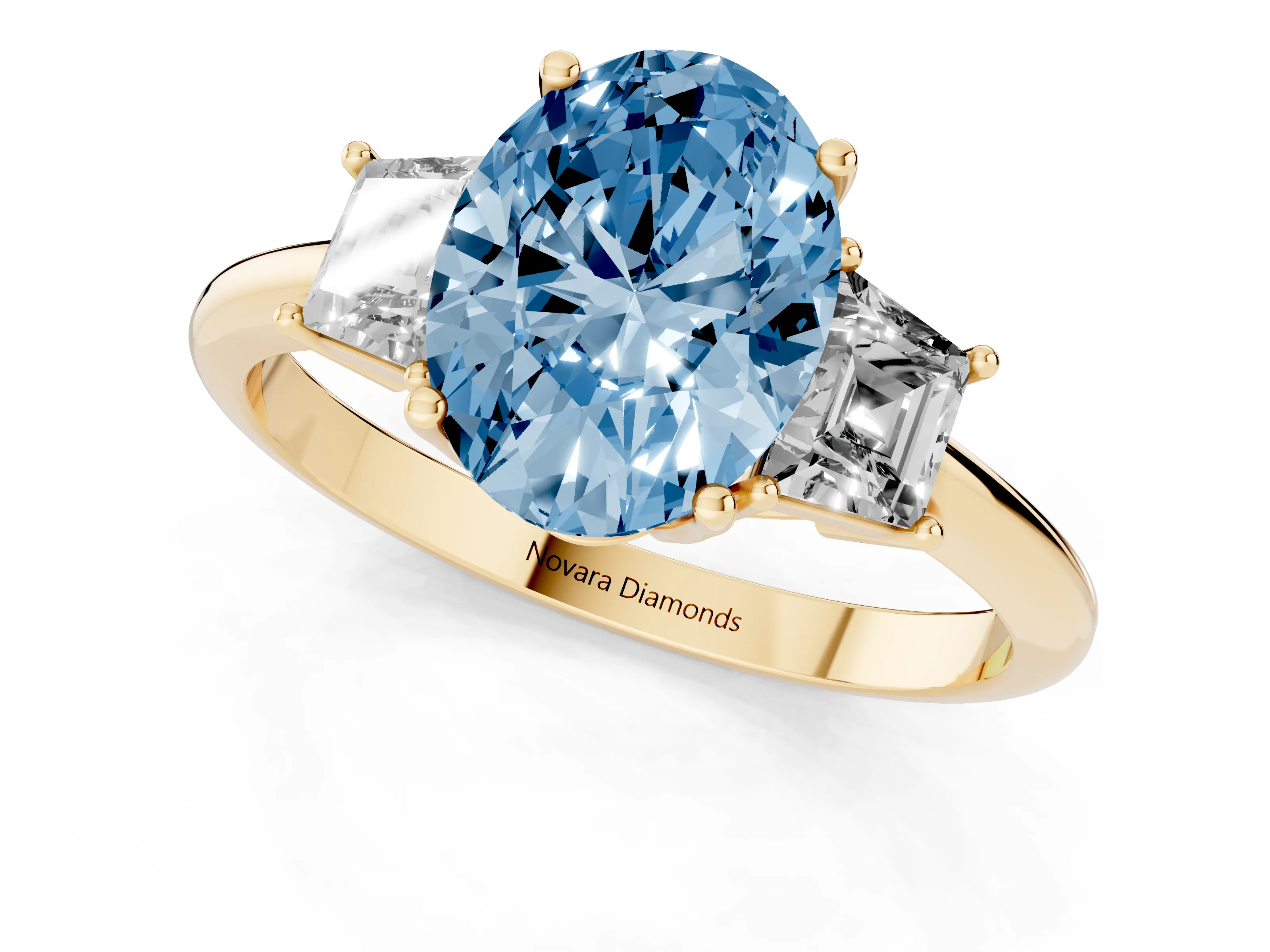Fancy Blue Oval Cut Diamond Three-Stone Ring Set in Yellow gold with Trapezoid Side Stones and Prong Setting