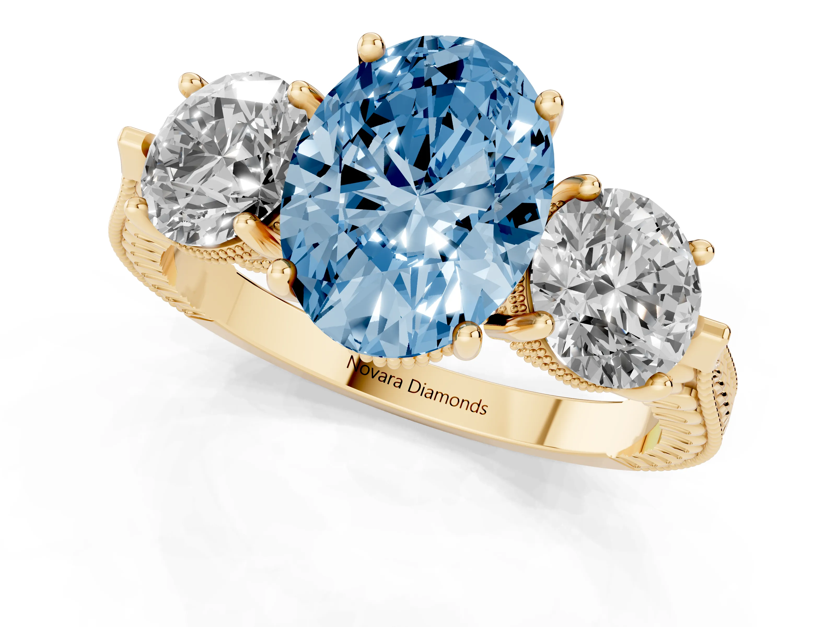 Fancy Blue Oval Cut Diamond Three-Stone Ring Set in Yellow gold with Milgrain Band