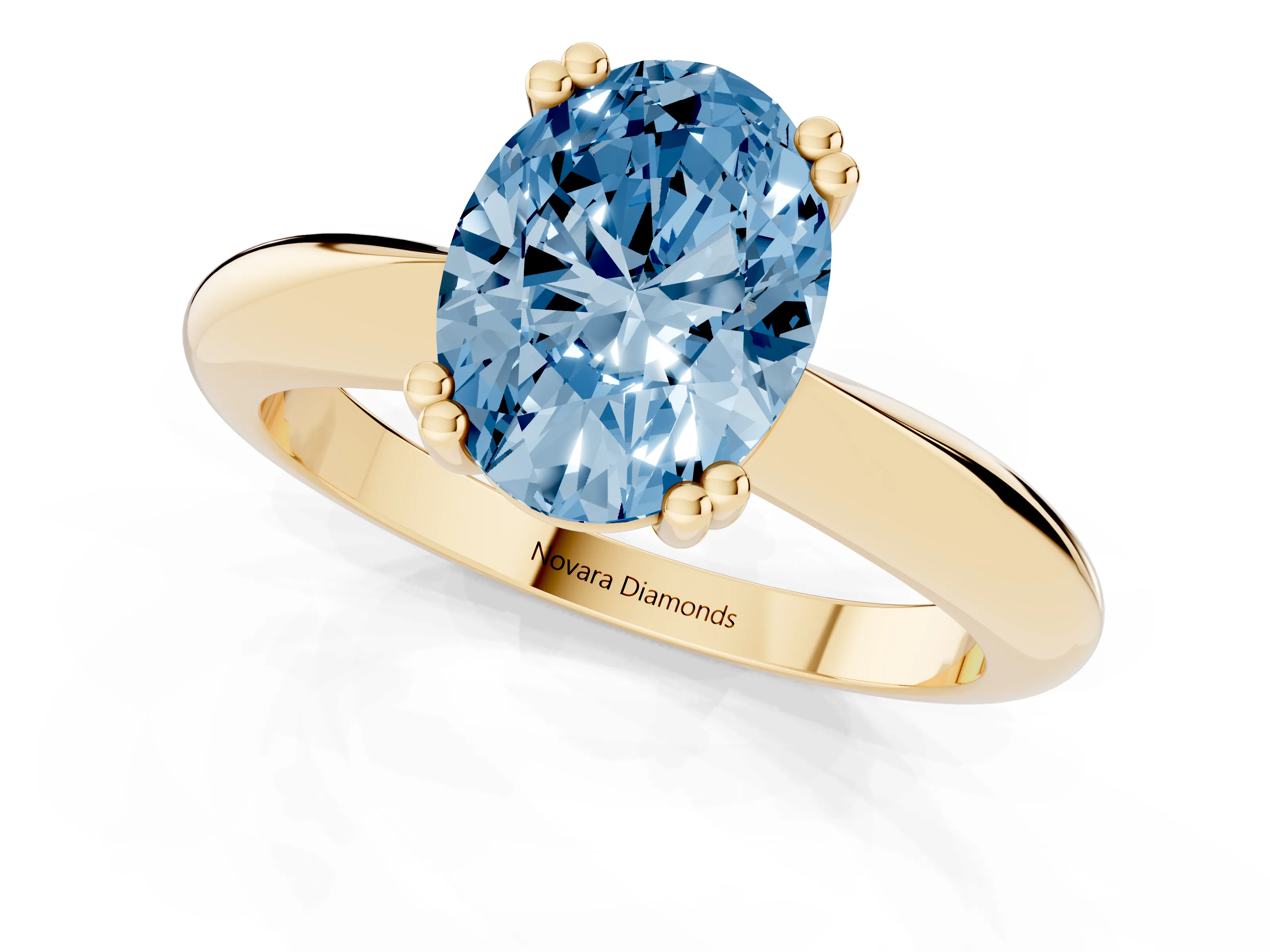 Fancy Blue Oval Cut Diamond Solitaire Engagement Ring Set in Yellow gold with Tapered Band and Prong Setting