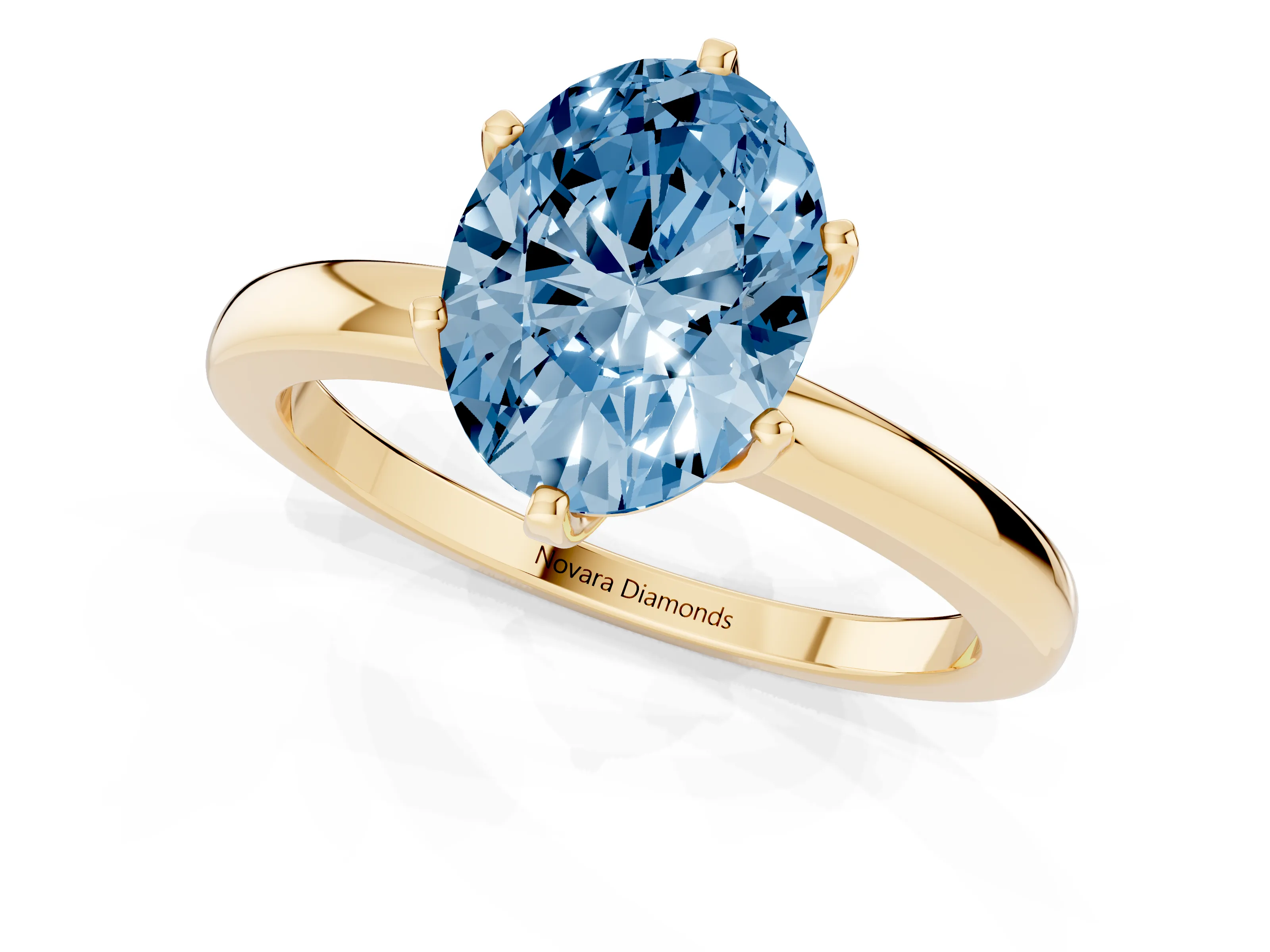 Fancy Blue Oval Cut Diamond Solitaire Ring Set in Yellow gold with Raised Prong Setting on a Classic Band
