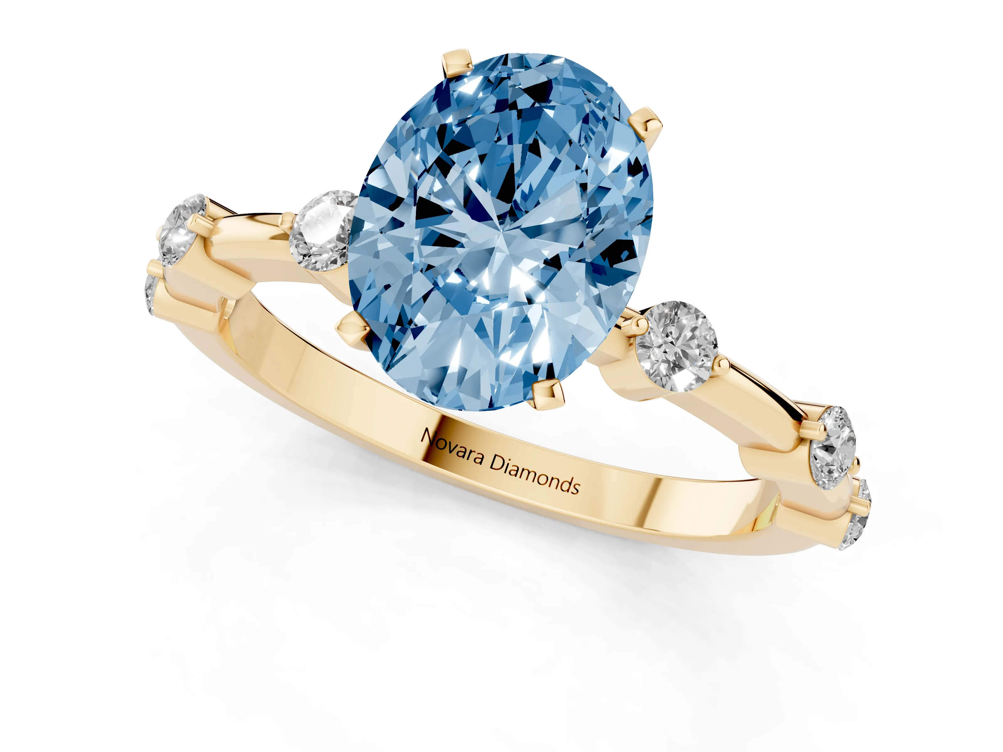 Fancy Blue Oval Cut Diamond Solitaire Ring Set in Yellow gold with Bezel Set Side Stones and Prong Setting