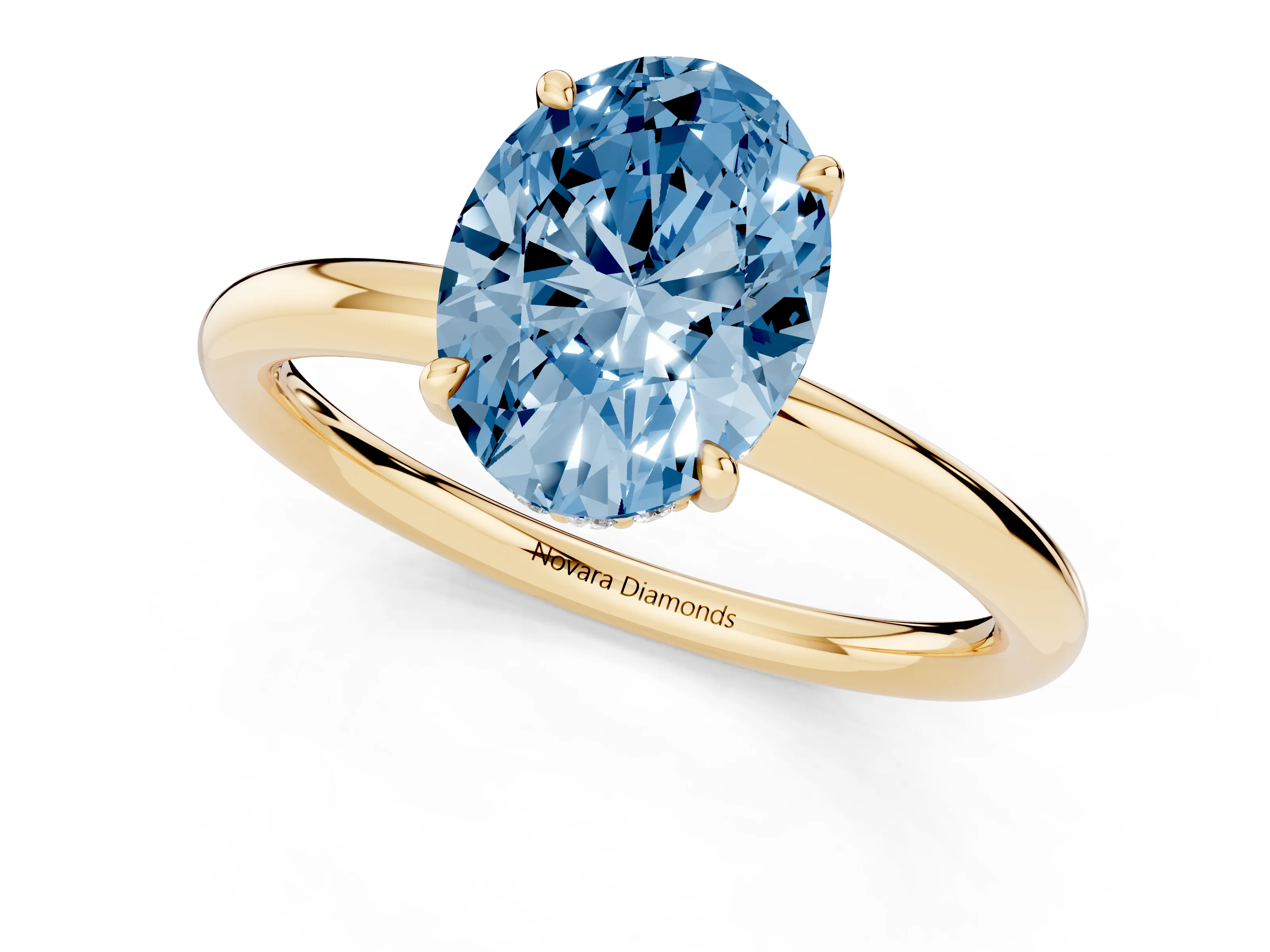 Fancy Blue Oval Cut Diamond Solitaire Ring Set in Yellow gold with Thin Band and Prong Setting