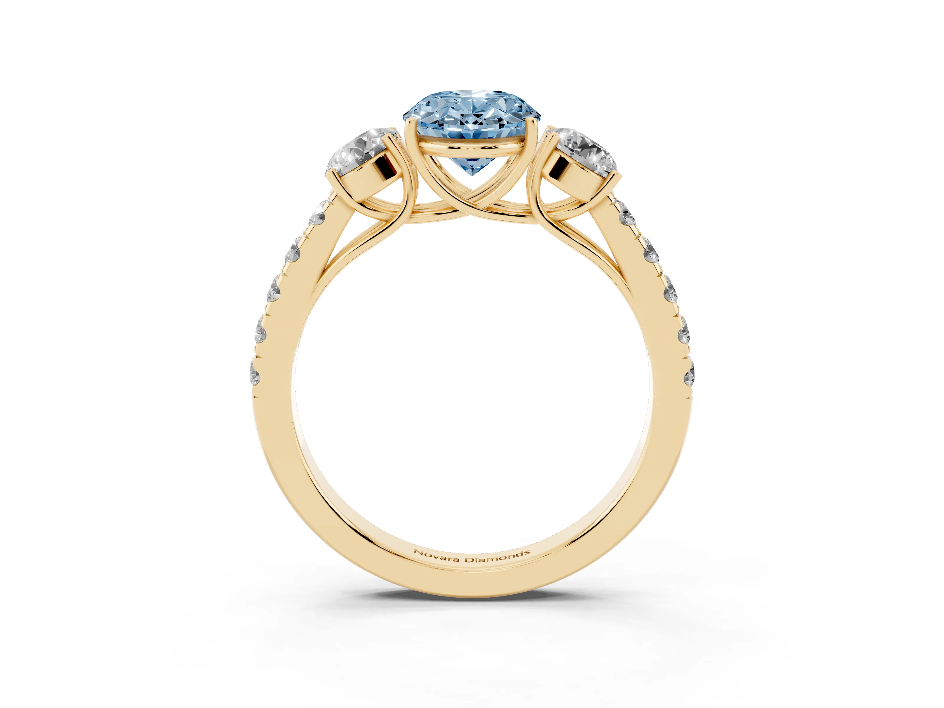 Fancy Blue Oval Cut Diamond Three-Stone Ring Set in Yellow gold with Round Side Stones and Delicate Pavé Band