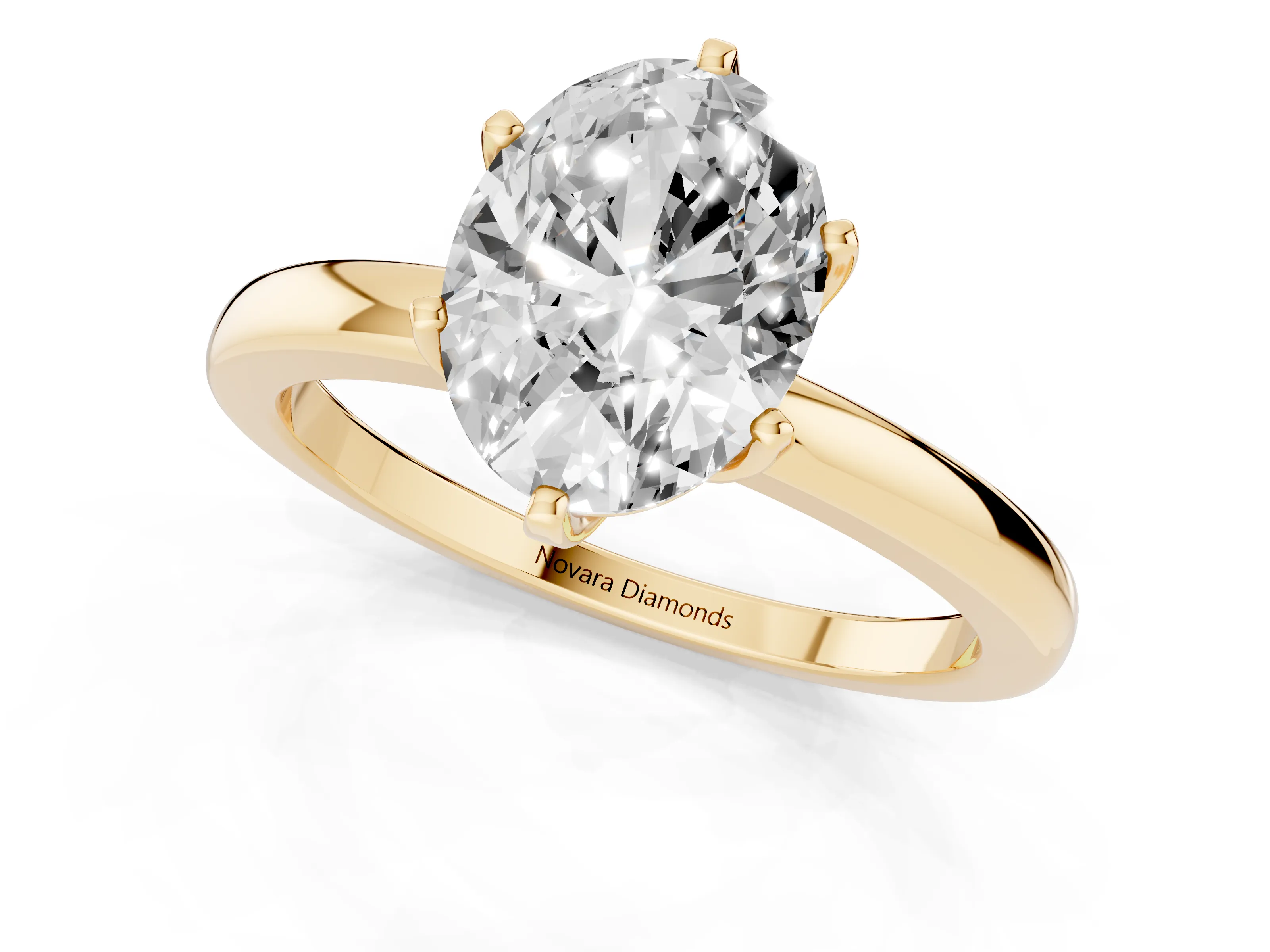 Oval Cut Diamond Solitaire Ring Set in Yellow gold with Raised Prong Setting on a Classic Band