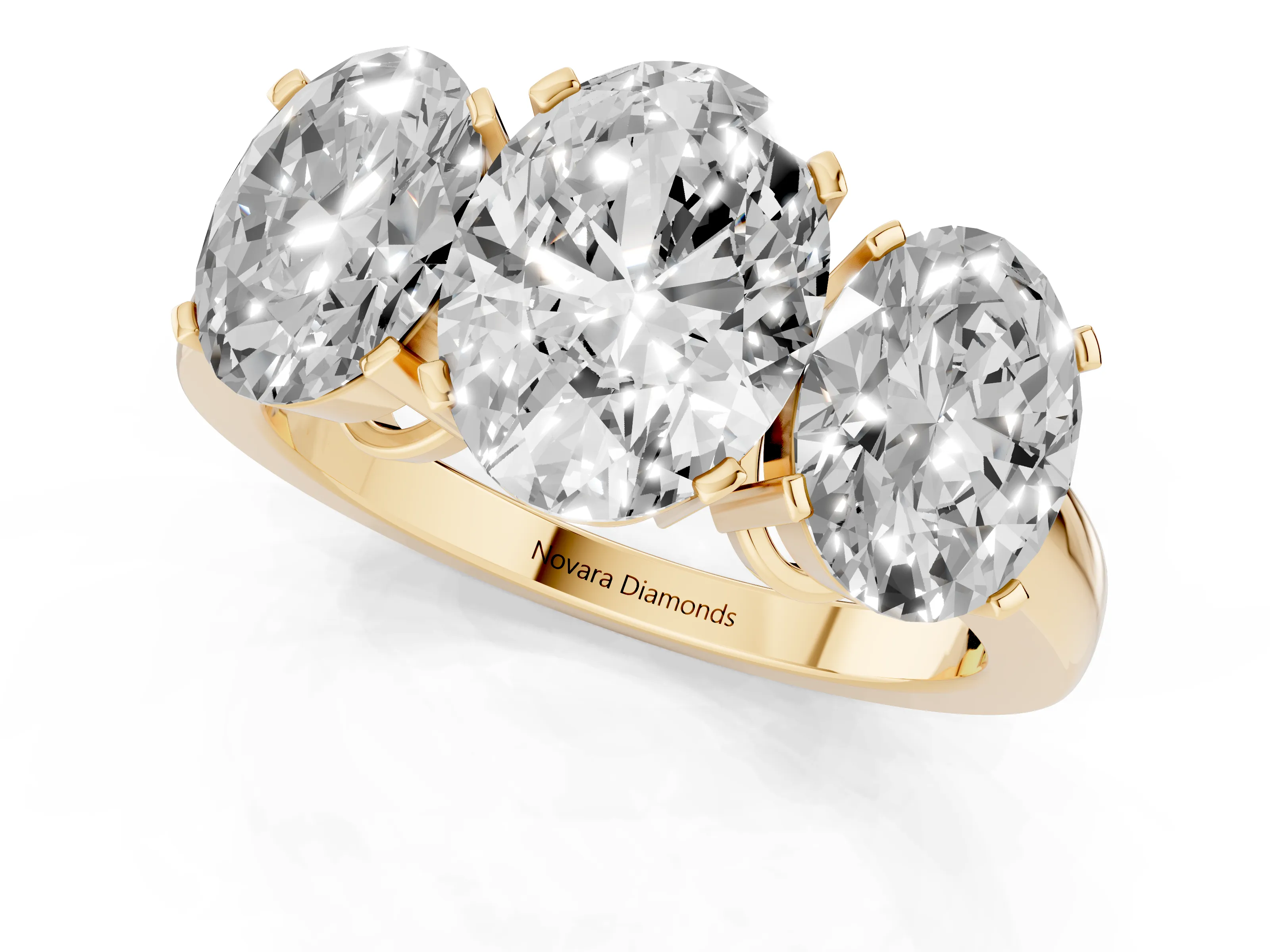 Oval Cut Diamond Three-Stone Ring Set in Yellow gold with Channel-Set Band and Prong Settings