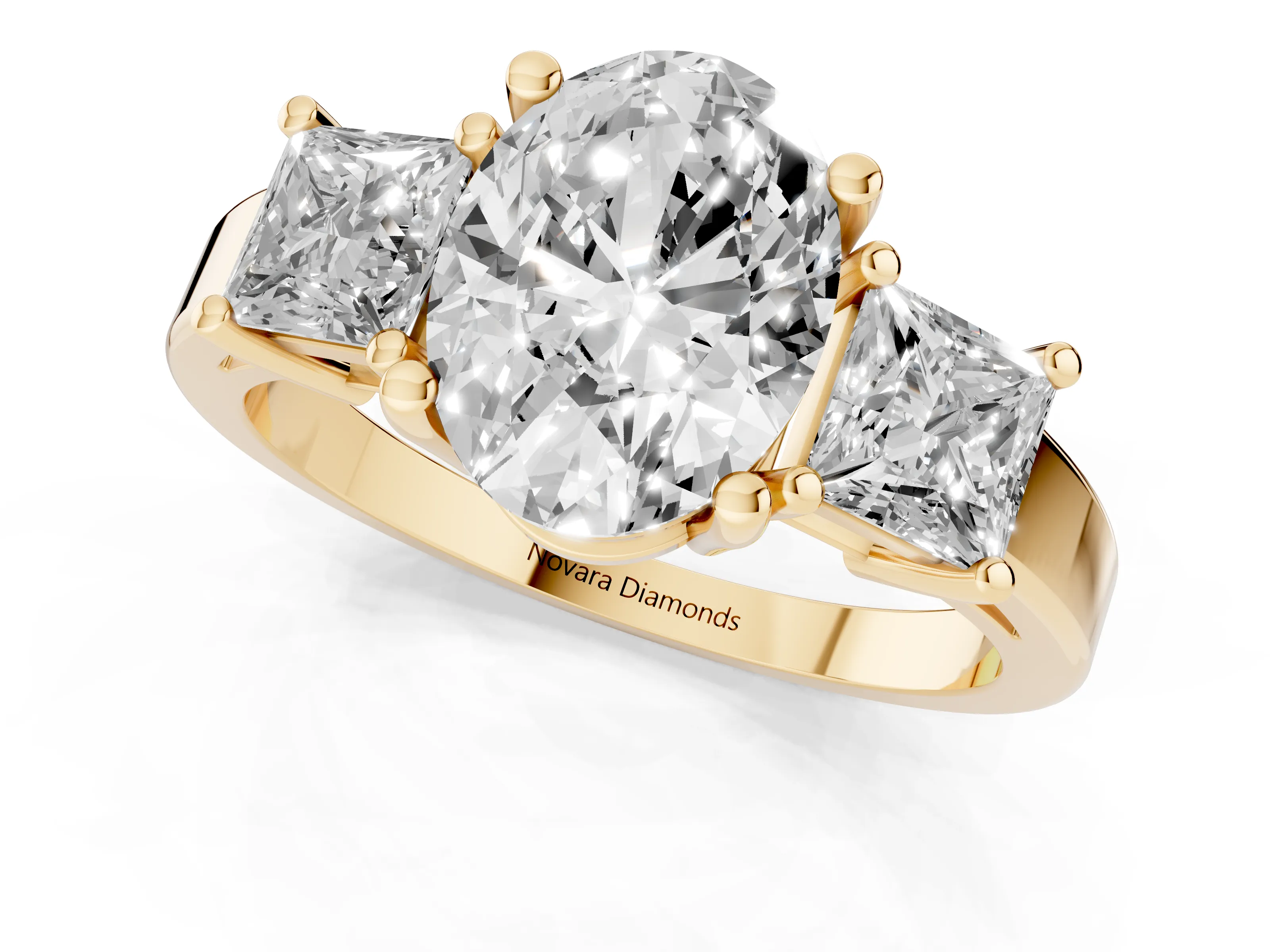 Three-Stone Oval Cut Diamond Solitaire Ring Set in Yellow gold with Prong Setting
