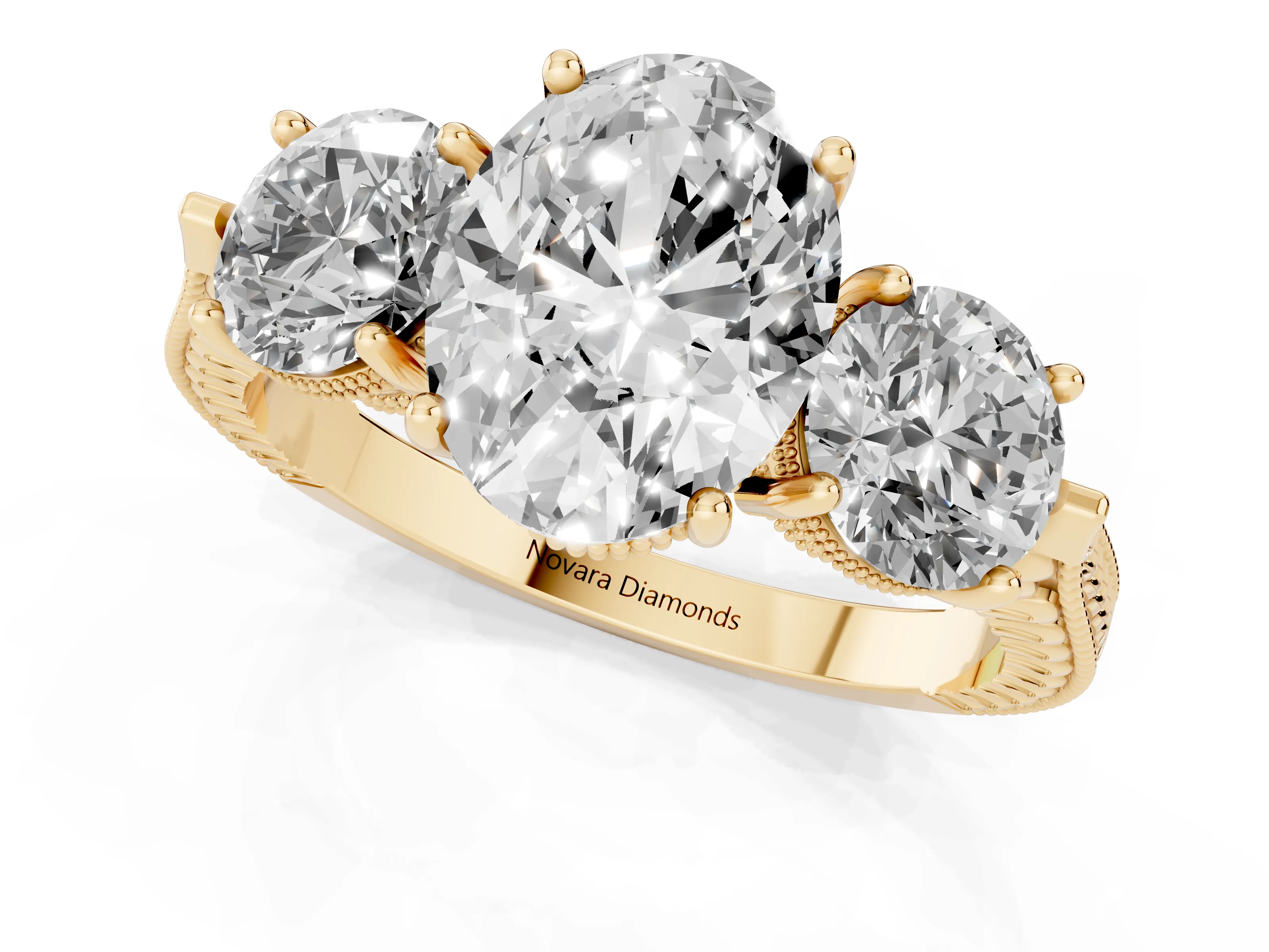 Oval Cut Diamond Three-Stone Ring Set in Yellow gold with Milgrain Band