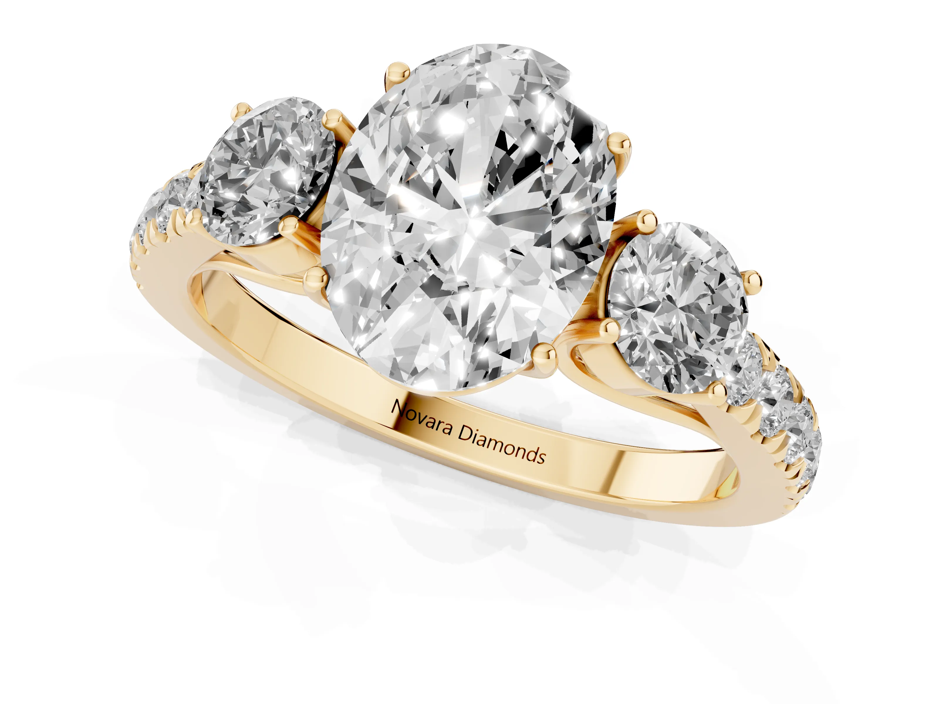 Oval Cut Diamond Three-Stone Ring Set in Yellow gold with Round Side Stones and Delicate Pavé Band