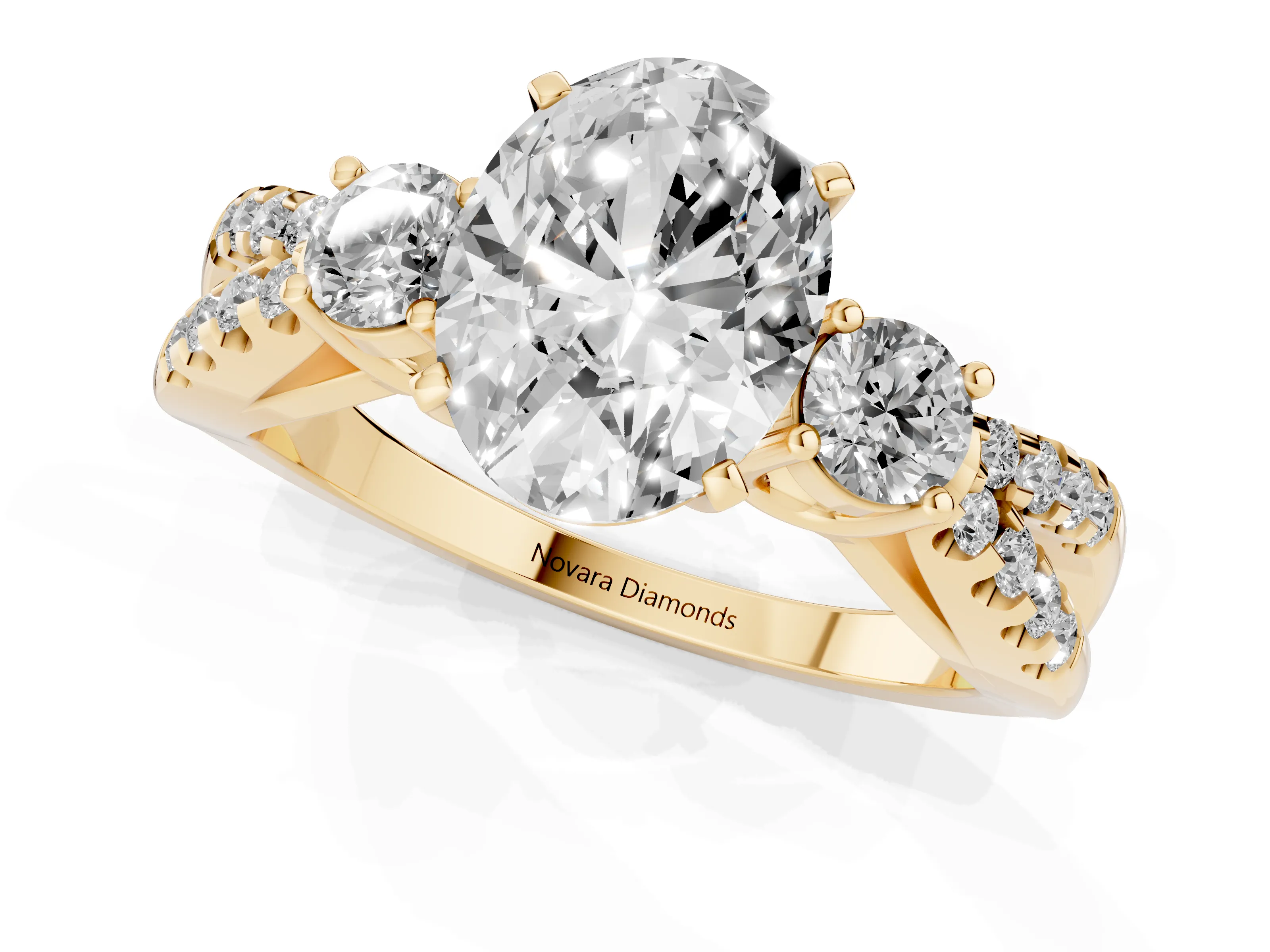 Oval Cut Diamond Three-Stone Ring Set in Yellow gold with Pavé Split Shank and Prong Setting
