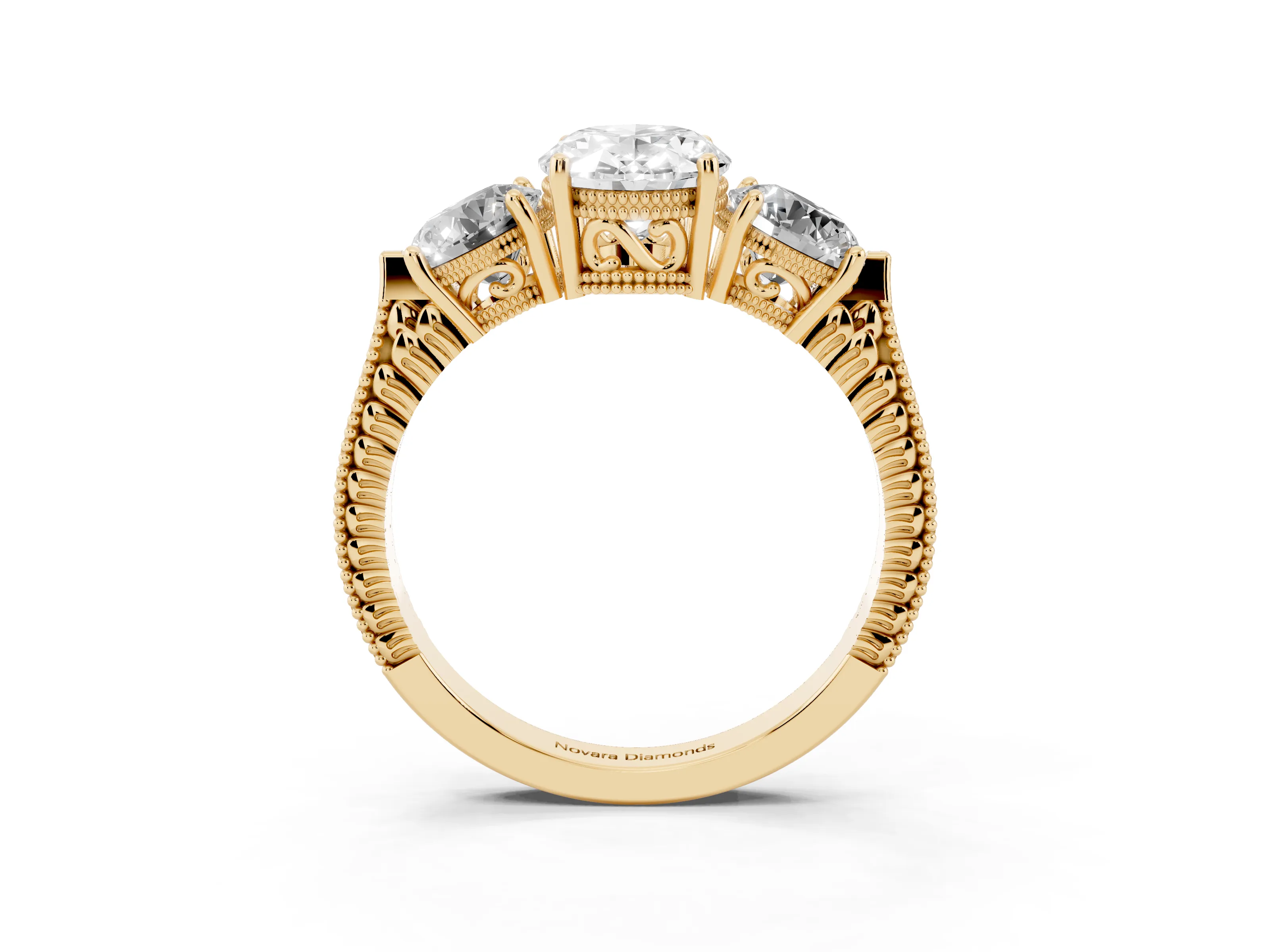 Oval Cut Diamond Three-Stone Ring Set in Yellow gold with Milgrain Band