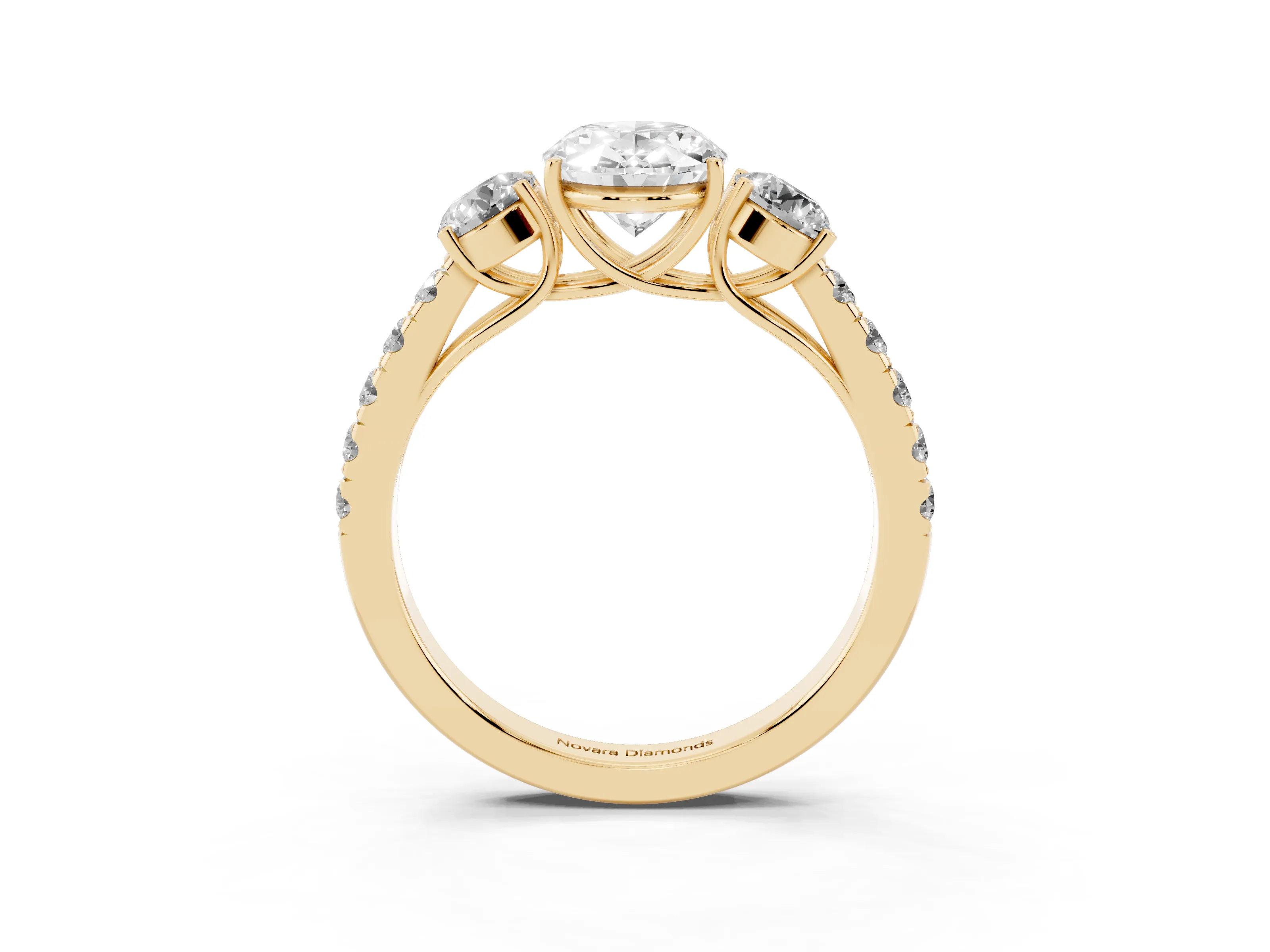 Oval Cut Diamond Three-Stone Ring Set in Yellow gold with Round Side Stones and Delicate Pavé Band