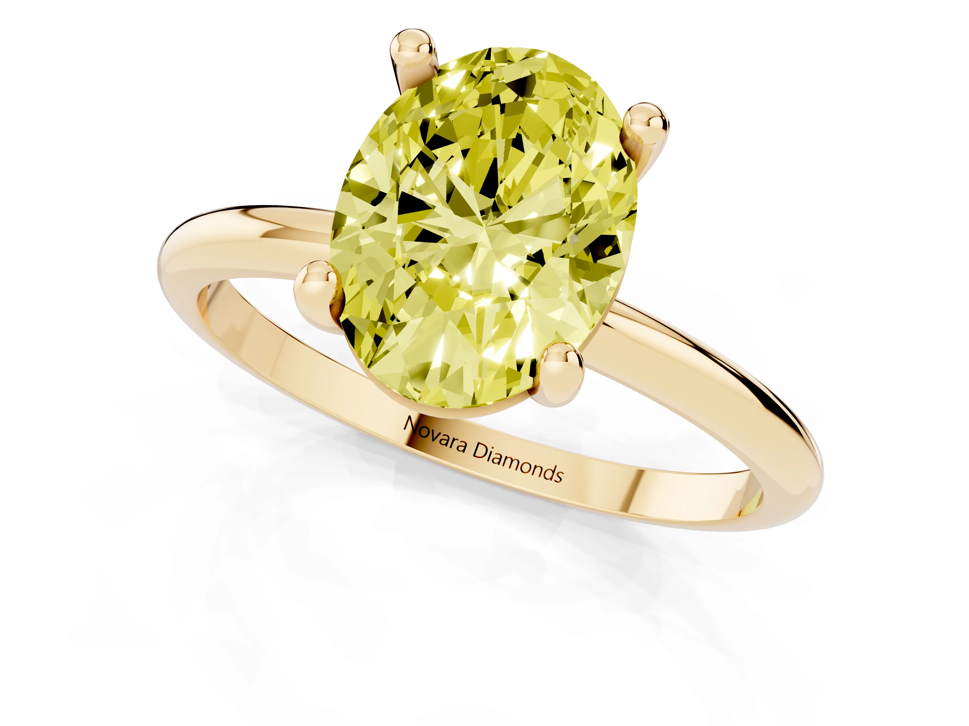 Fancy Yellow Oval Cut Diamond Solitaire Ring Set in Yellow gold with Secure Prong Setting on a Classic Band