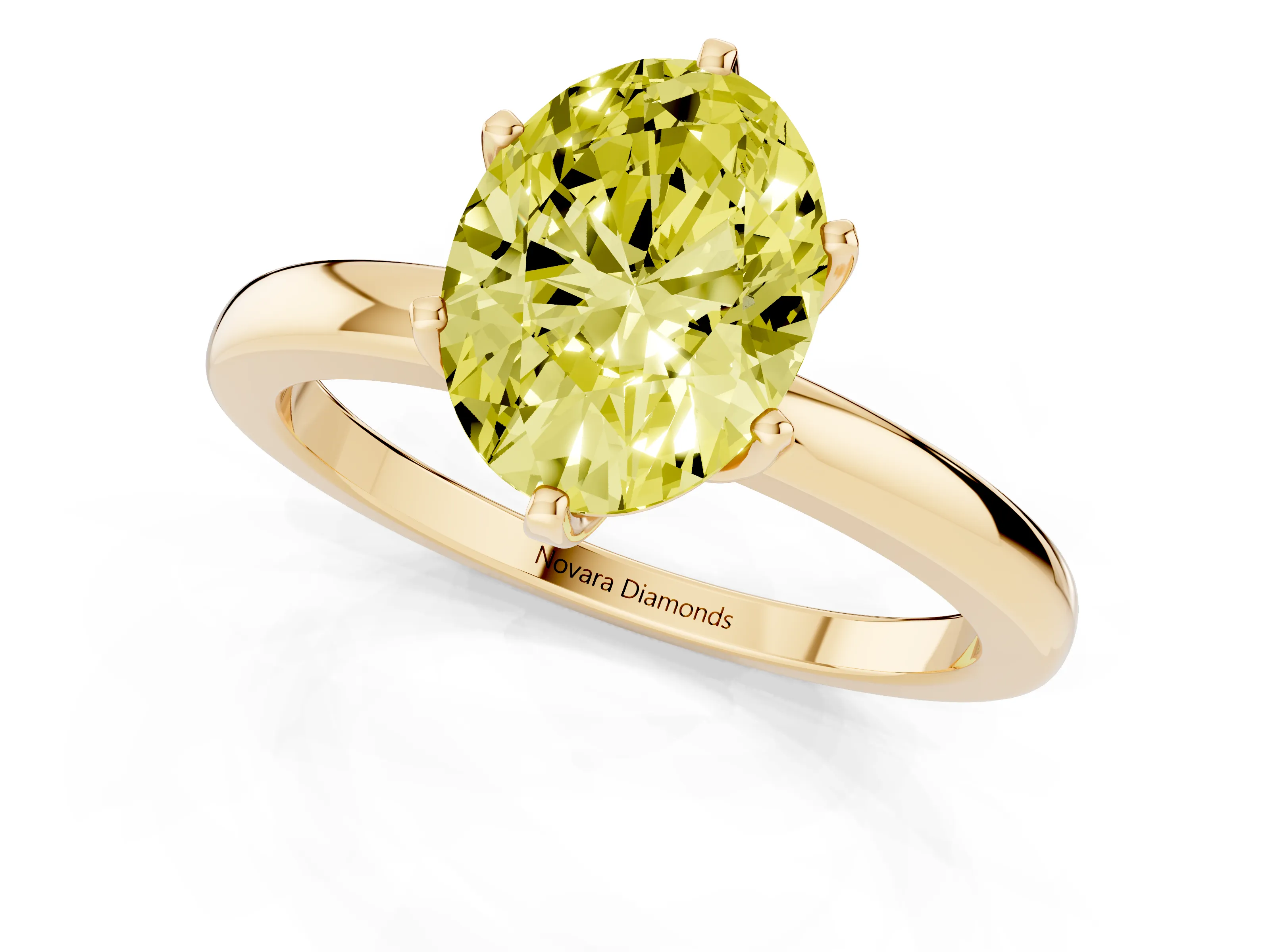 Fancy Yellow Oval Cut Diamond Solitaire Ring Set in Yellow gold with Raised Prong Setting on a Classic Band
