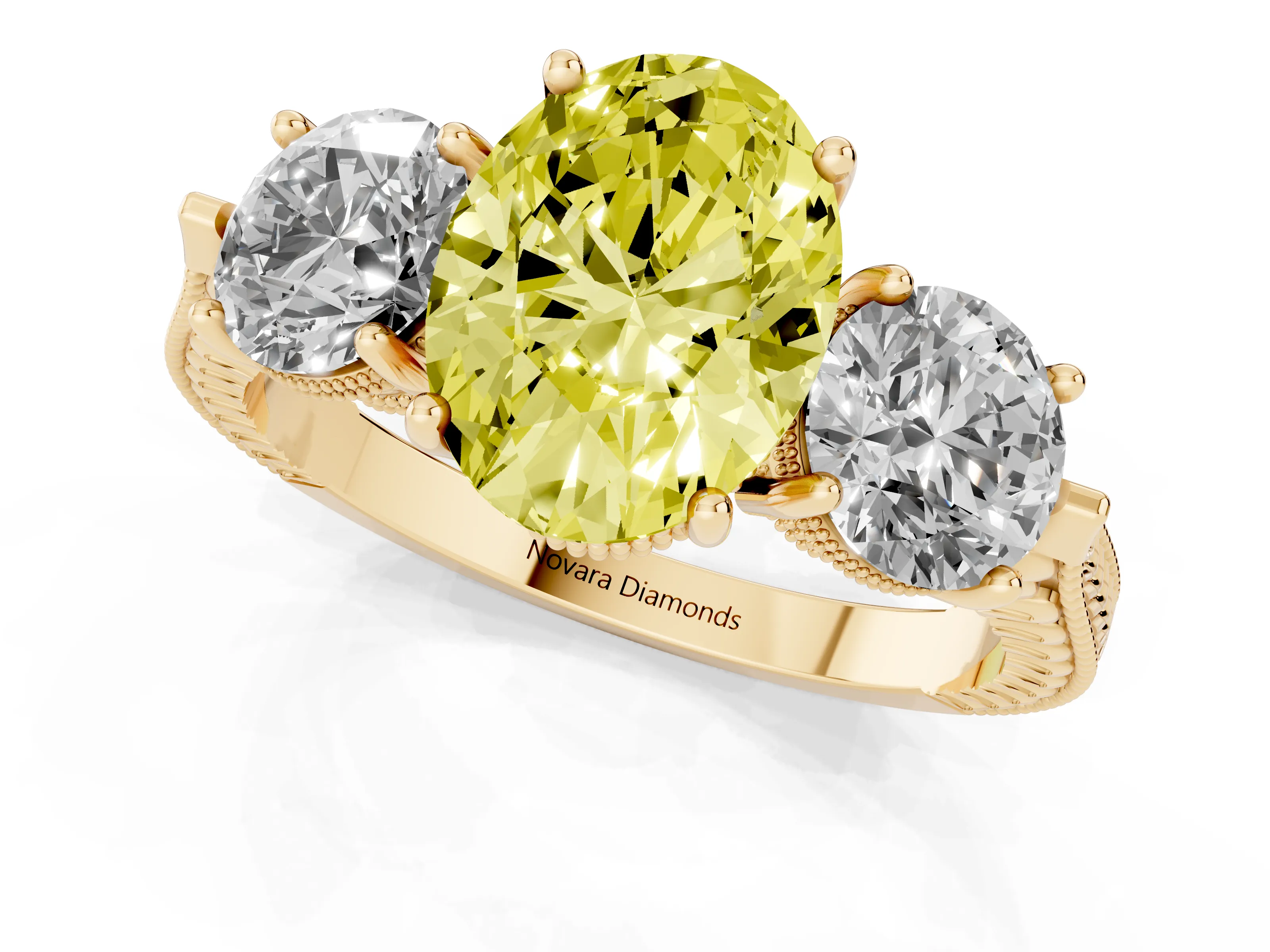 Fancy Yellow Oval Cut Diamond Three-Stone Ring Set in Yellow gold with Milgrain Band