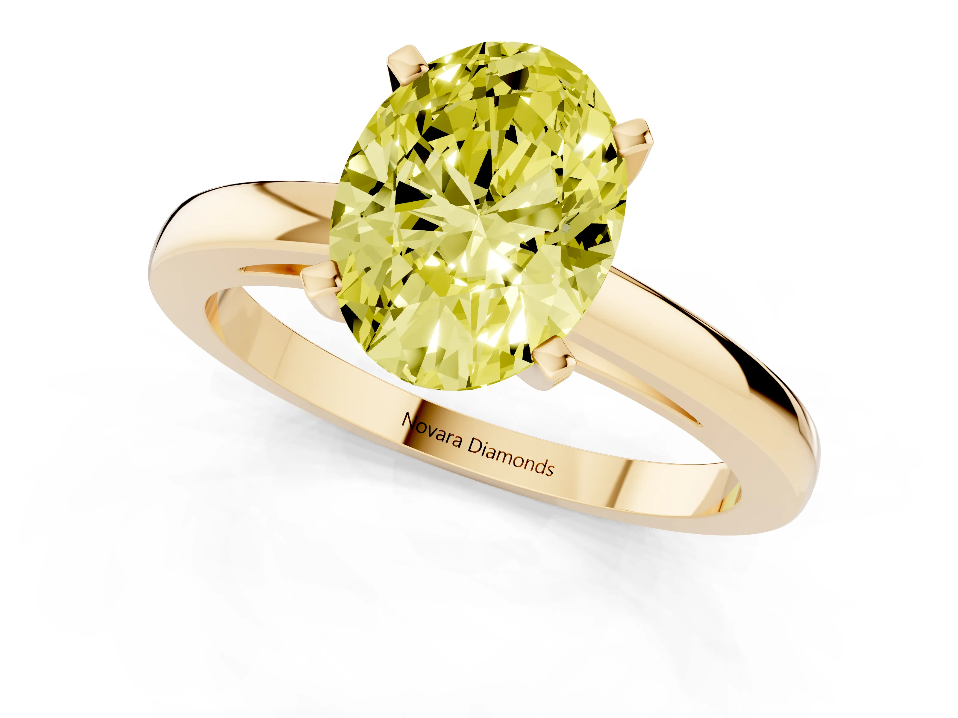 Fancy Yellow Oval Cut Diamond Solitaire Engagement Ring Set in Yellow gold with Prong Setting on a Classic Band