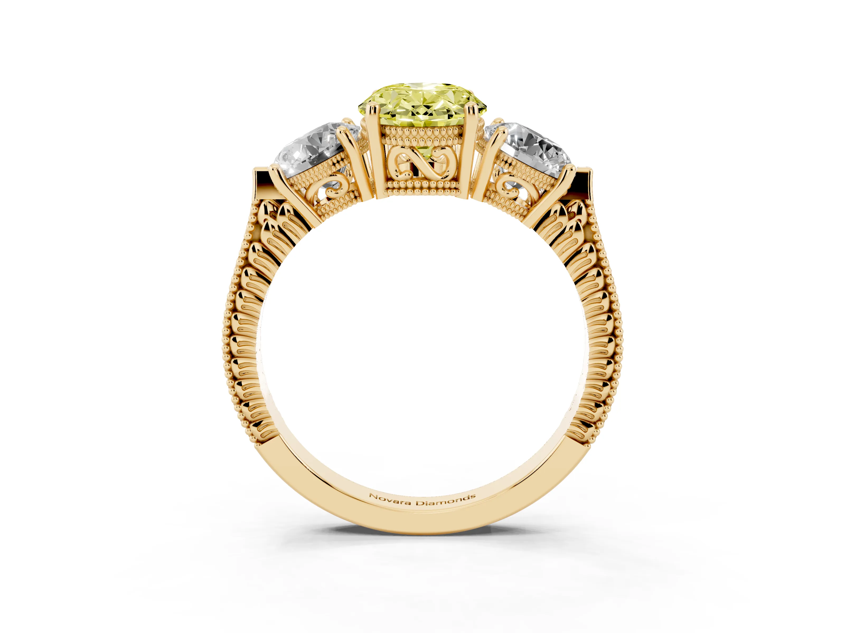 Fancy Yellow Oval Cut Diamond Three-Stone Ring Set in Yellow gold with Milgrain Band