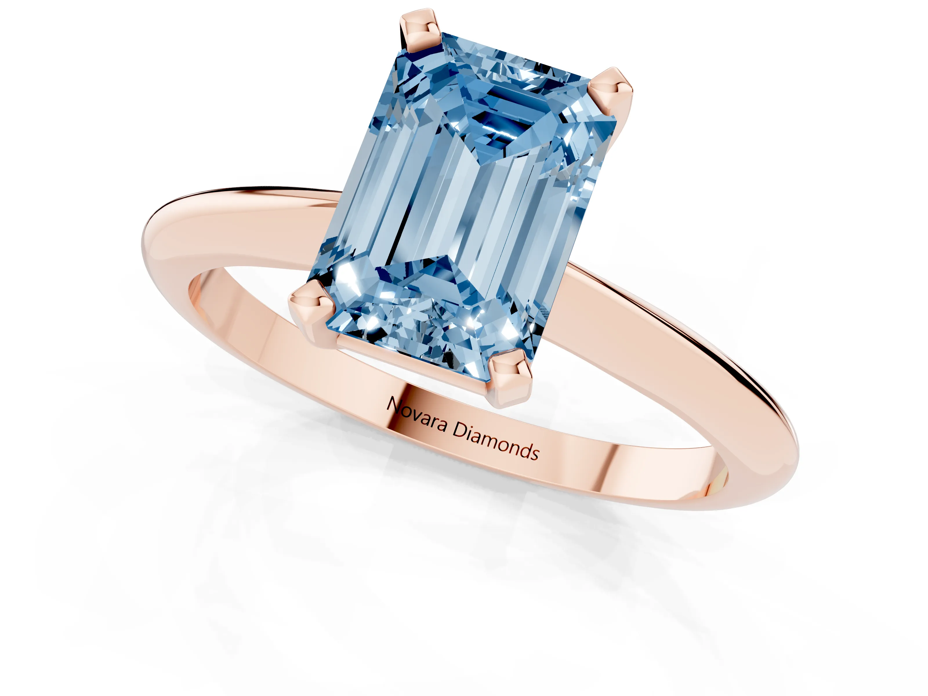 Fancy Blue Emerald Cut Diamond Solitaire Ring Set in Rose gold with Prong Setting on a Plain Round Band