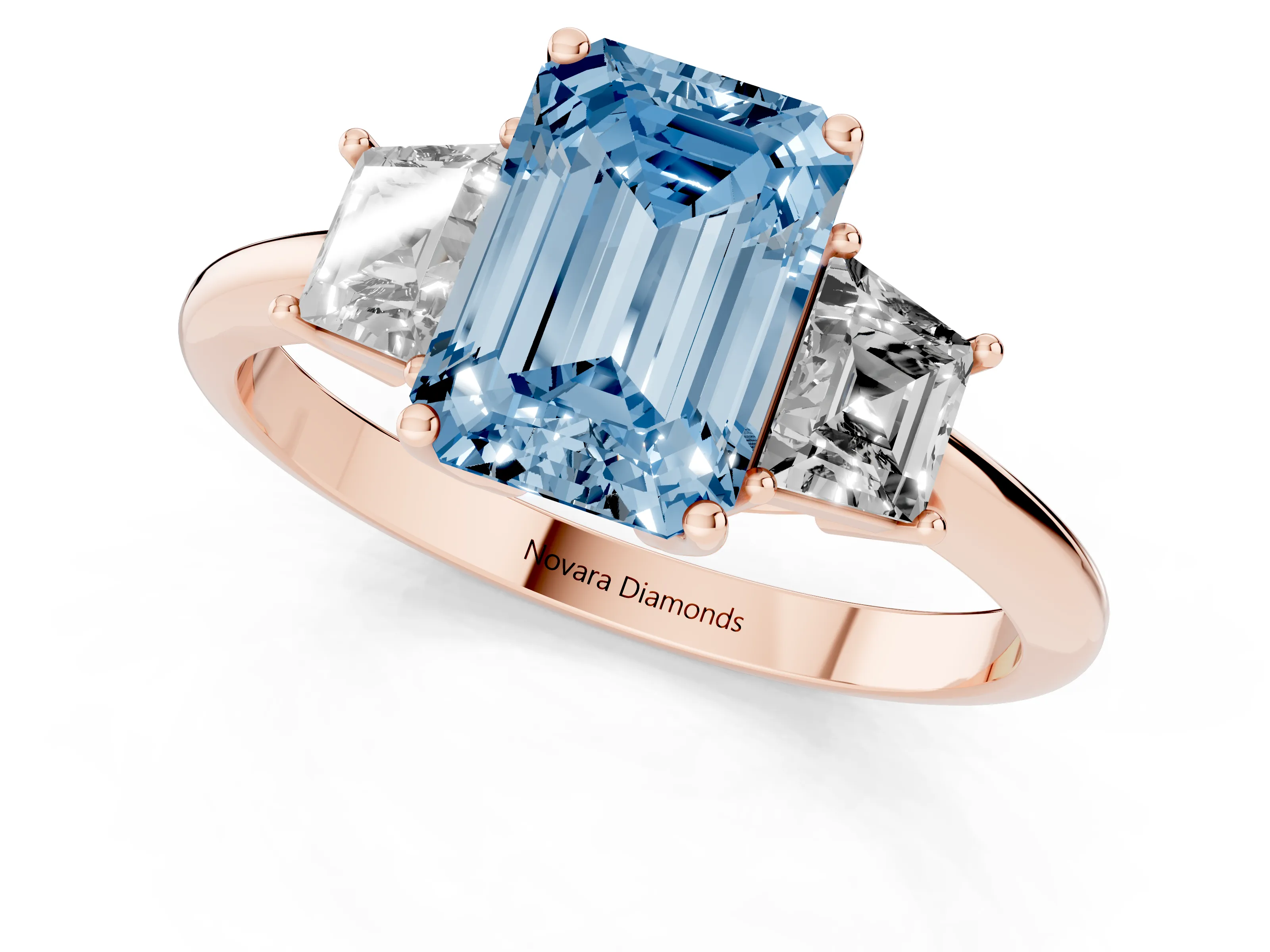 Fancy Blue Emerald Cut Diamond Three-Stone Ring Set in Rose gold with Trapezoid Side Stones and Prong Setting