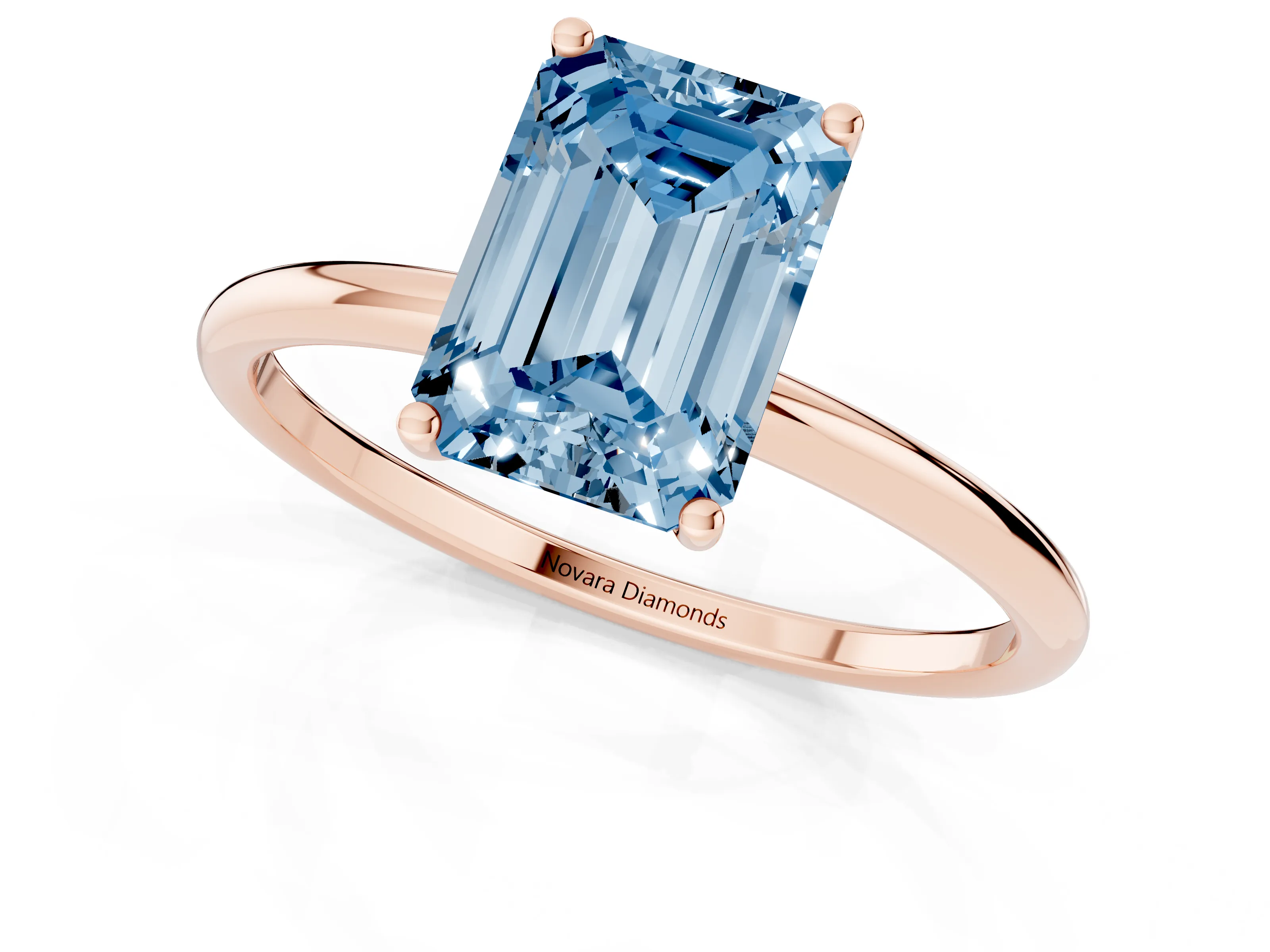 Fancy Blue Emerald Cut Diamond Solitaire Engagement Ring Set in Rose gold with Thin Band and Prong Setting