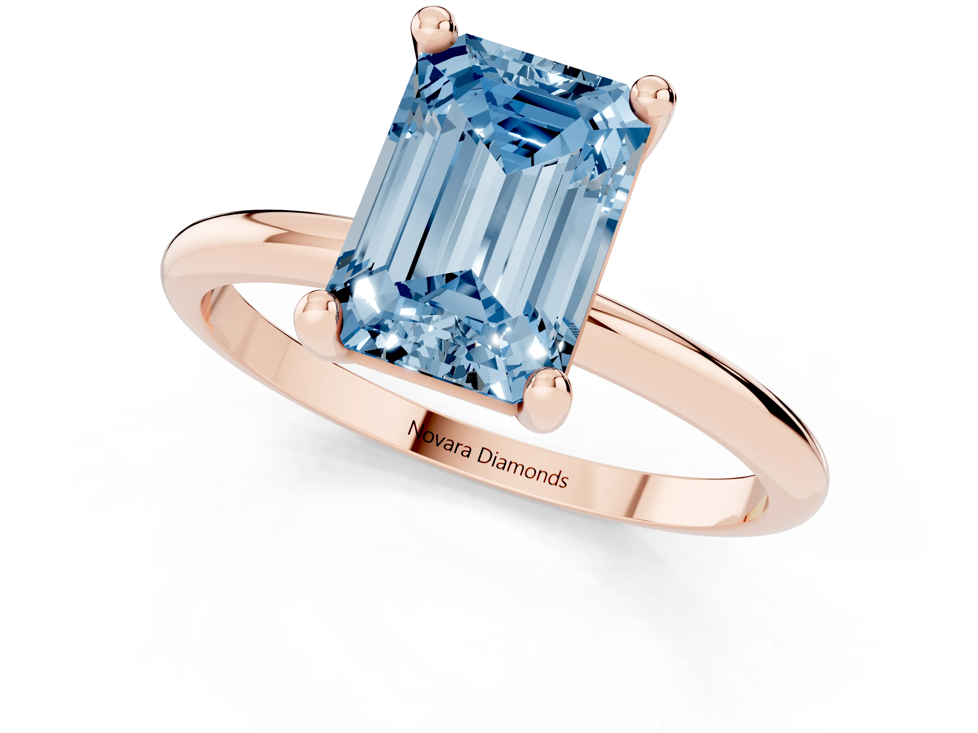 Fancy Blue Emerald Cut Diamond Solitaire Ring Set in Rose gold with Secure Prong Setting on a Classic Band