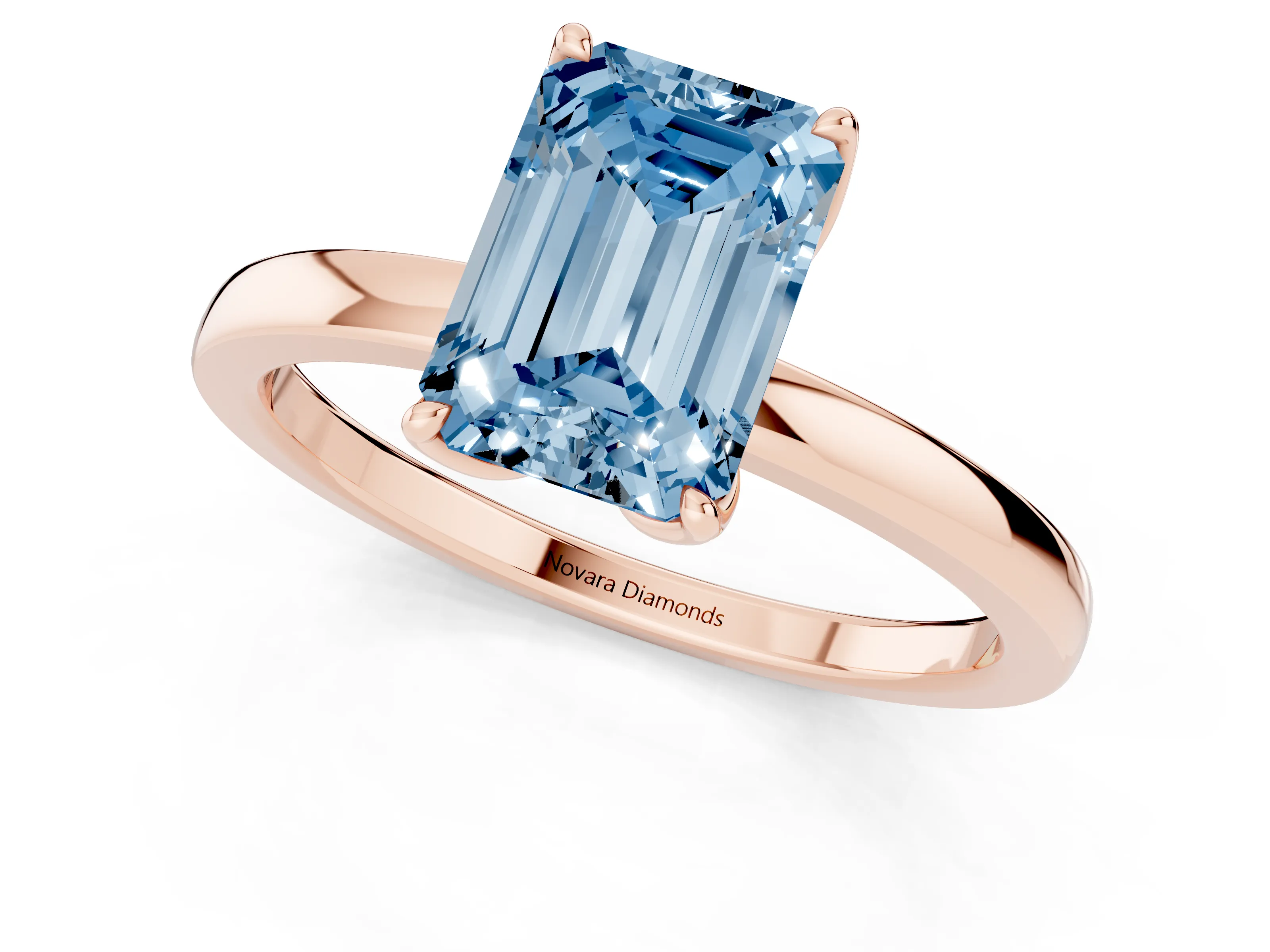 Fancy Blue Emerald Cut Diamond Solitaire Ring Set in Rose gold with Prong Setting and Thin Polished Band