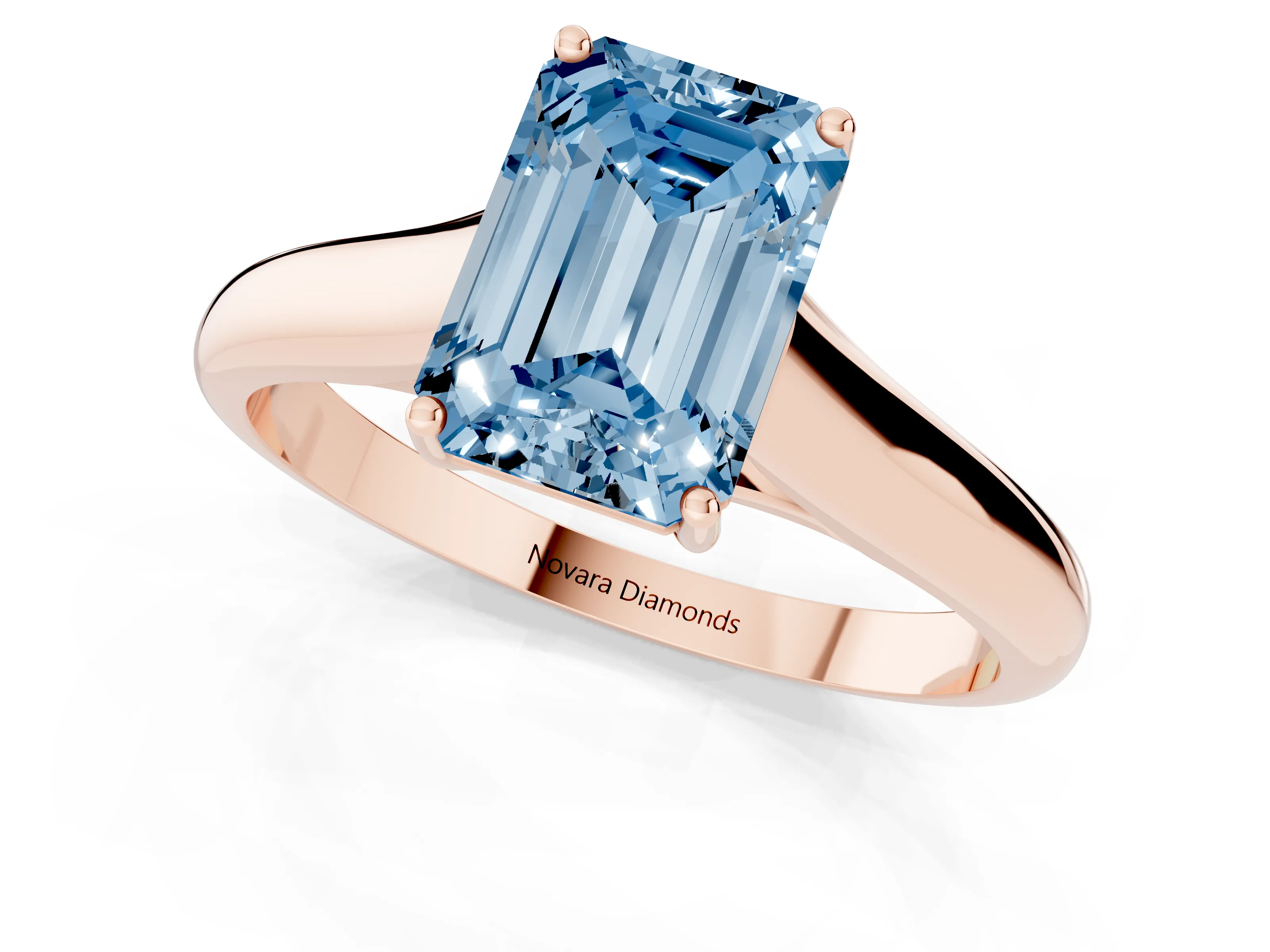 Fancy Blue Emerald Cut Diamond Solitaire Engagement Ring Set in Rose gold with Subtly Tapered Band and Prong Setting