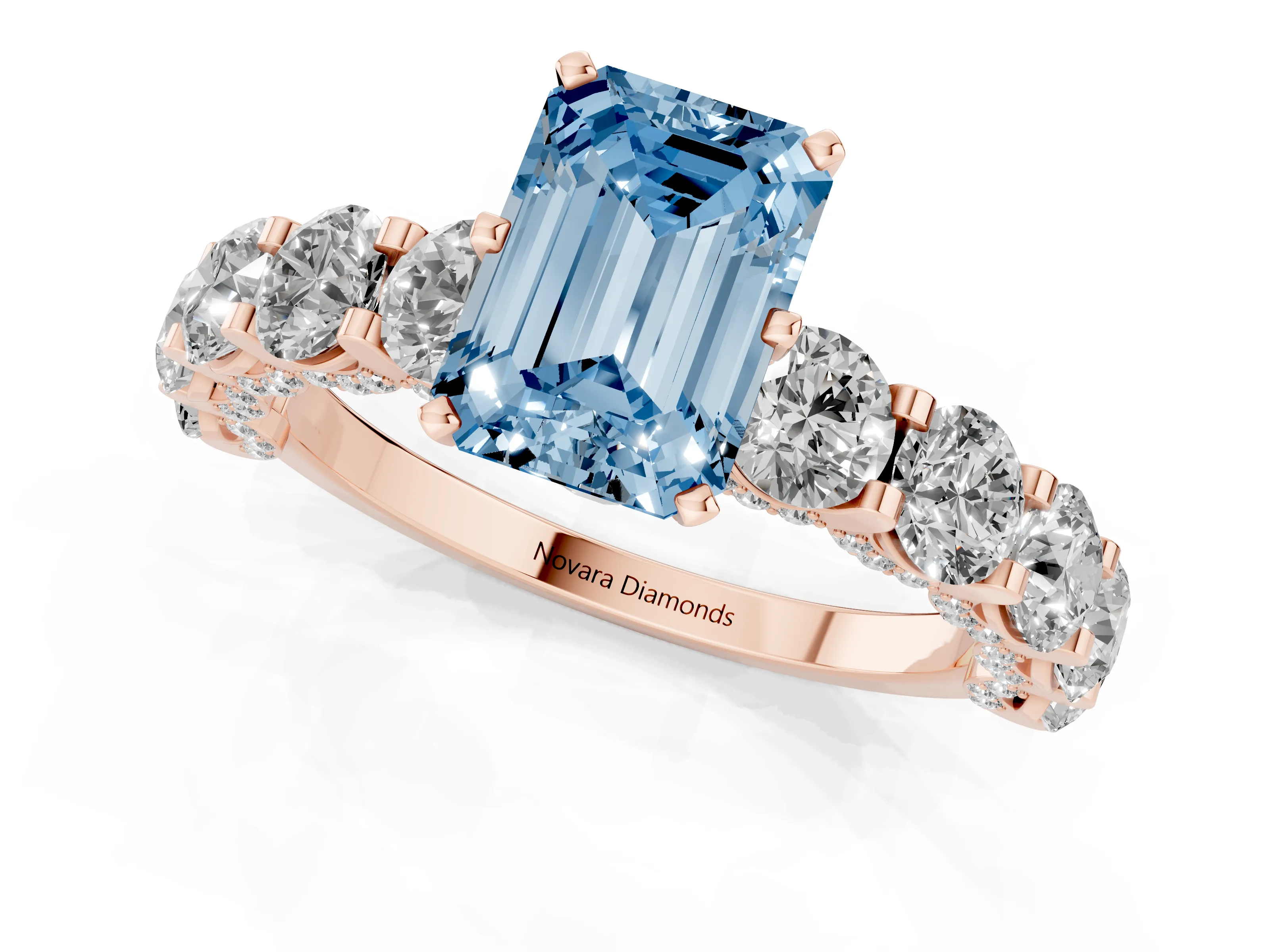 Fancy Blue Emerald Cut Diamond Side Stone Ring Set in Rose gold with Alternating Round and Oval Side Stones