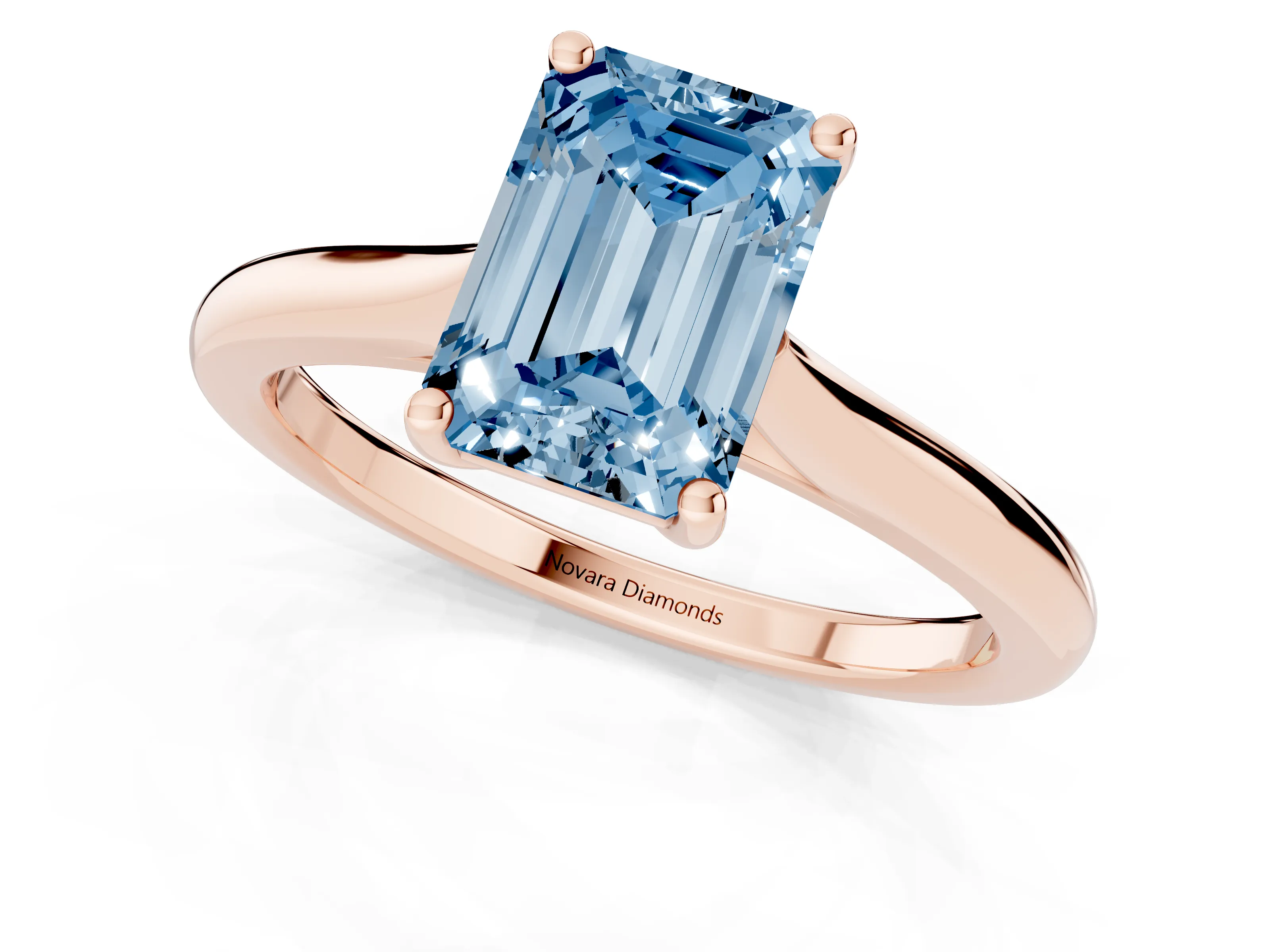 Fancy Blue Emerald Cut Diamond Solitaire Ring Set in Rose gold with Cathedral Band and Prong Setting