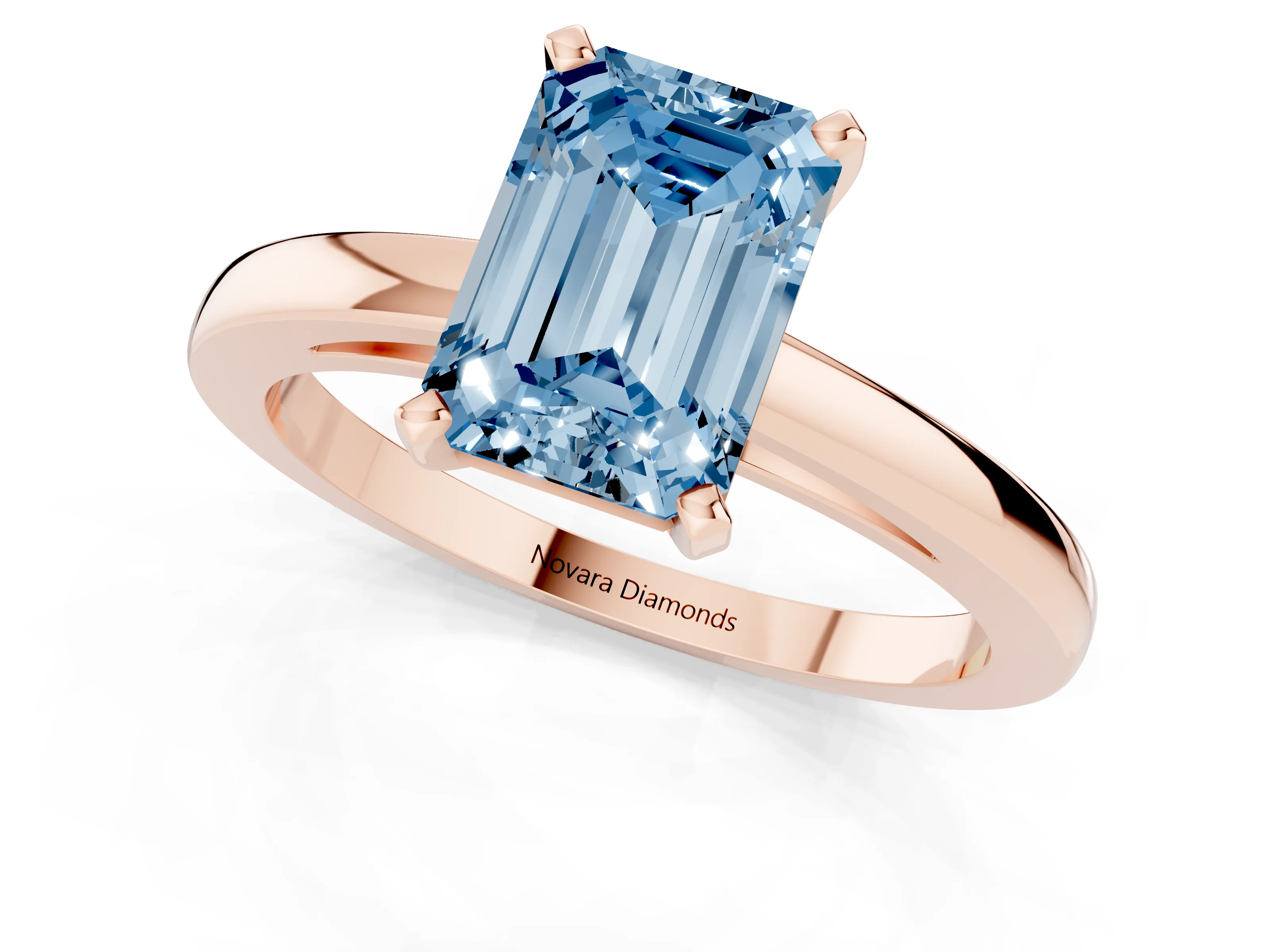 Fancy Blue Emerald Cut Diamond Solitaire Engagement Ring Set in Rose gold with Prong Setting on a Classic Band