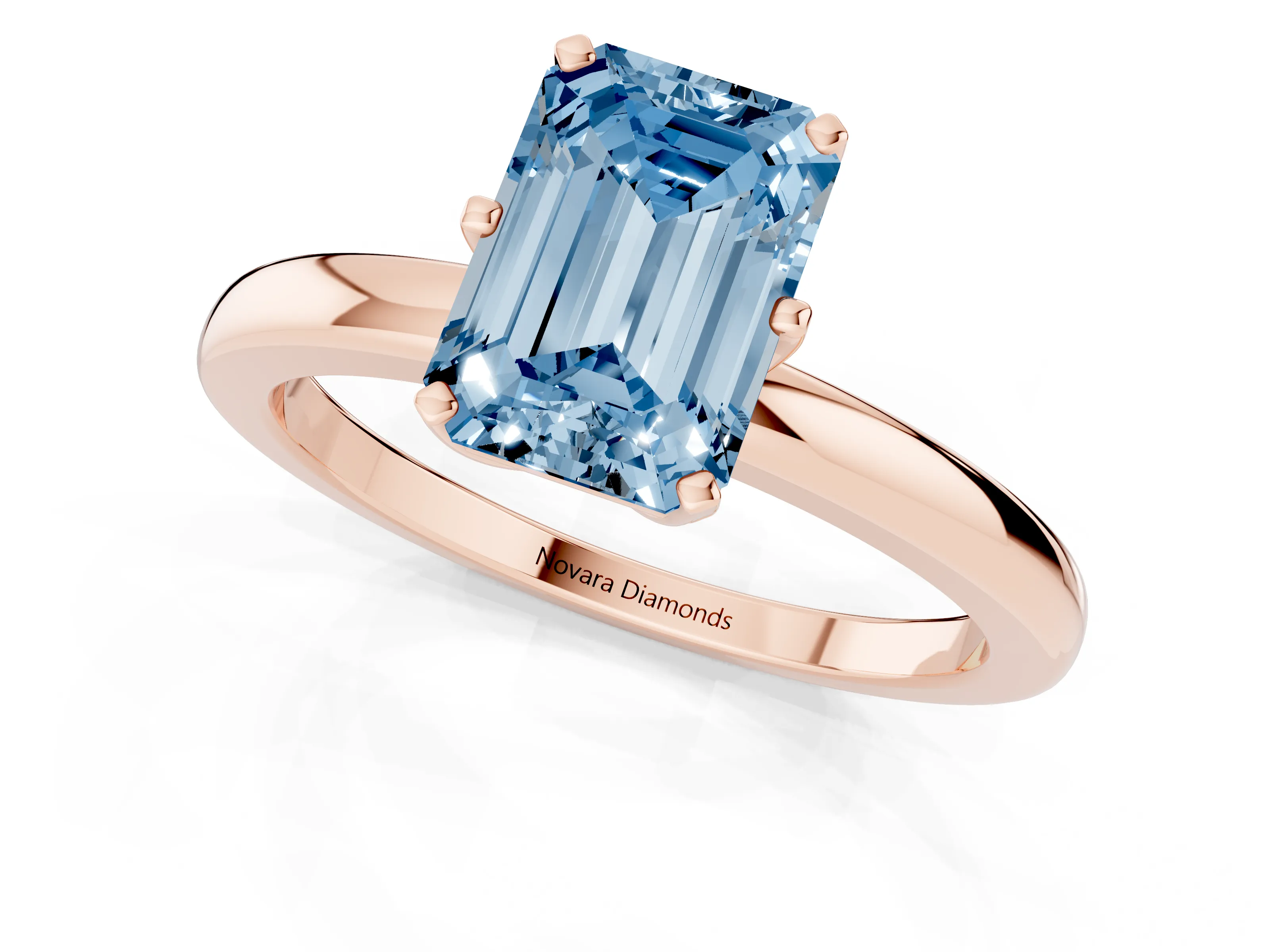 Fancy Blue Emerald Cut Diamond Solitaire Ring Set in Rose gold with Raised Prong Setting on a Classic Band