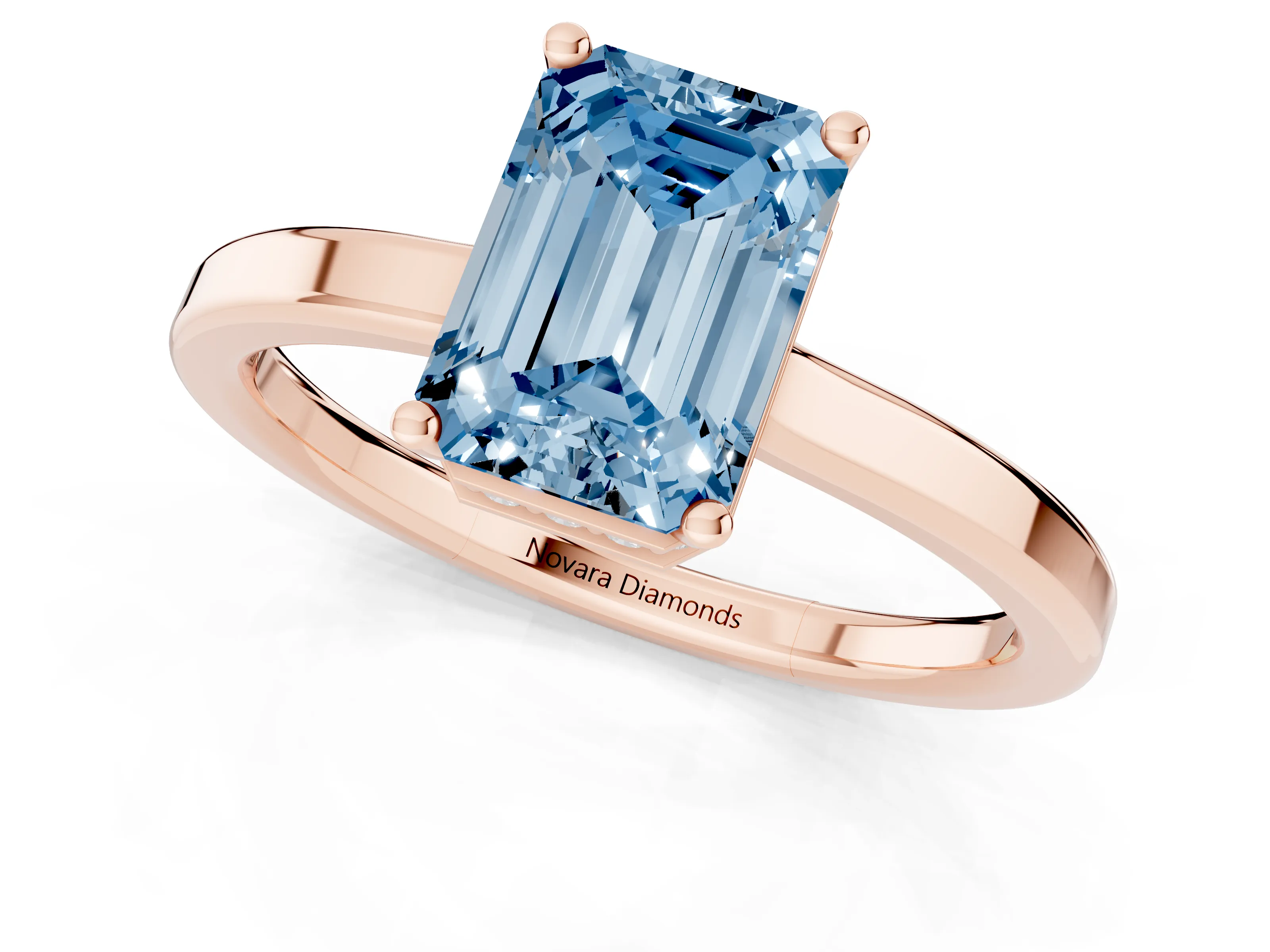 Fancy Blue Emerald Cut Diamond Solitaire Engagement Ring Set in Rose gold with Prong Setting on a Plain Band