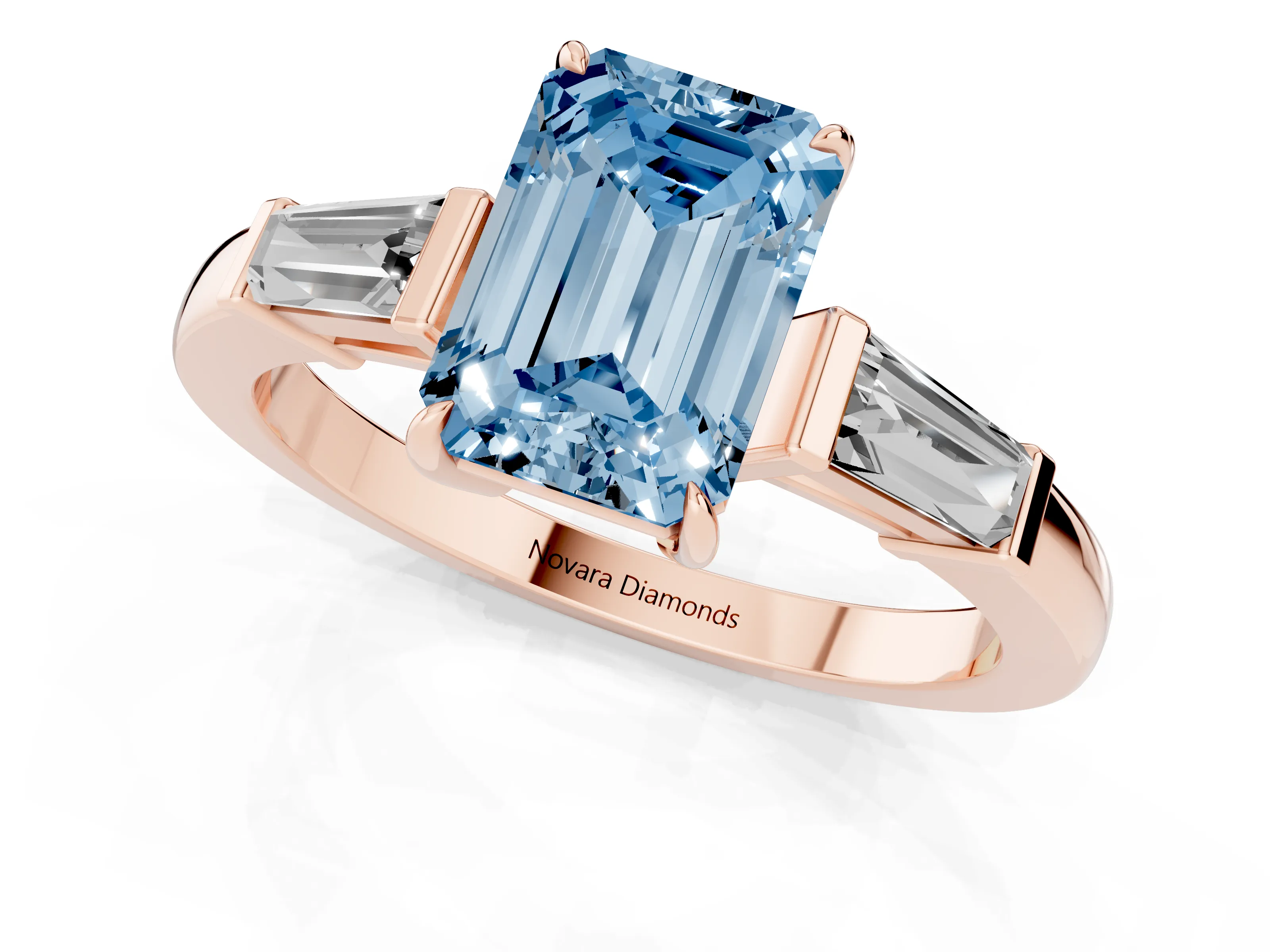 Fancy Blue Emerald Cut Diamond Three-Stone Ring Set in Rose gold with Tapered Baguette Side Stones and Prong Setting