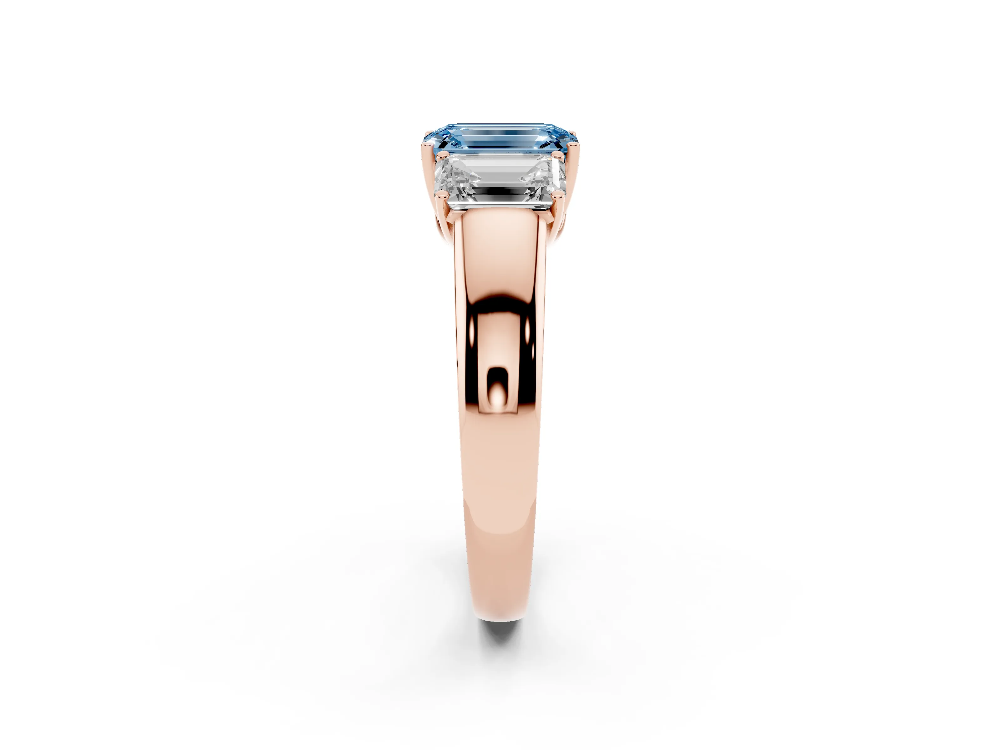 Fancy Blue Three-Stone Emerald Cut Diamond Ring Set in Rose gold with Matching Prong Settings and Plain Band