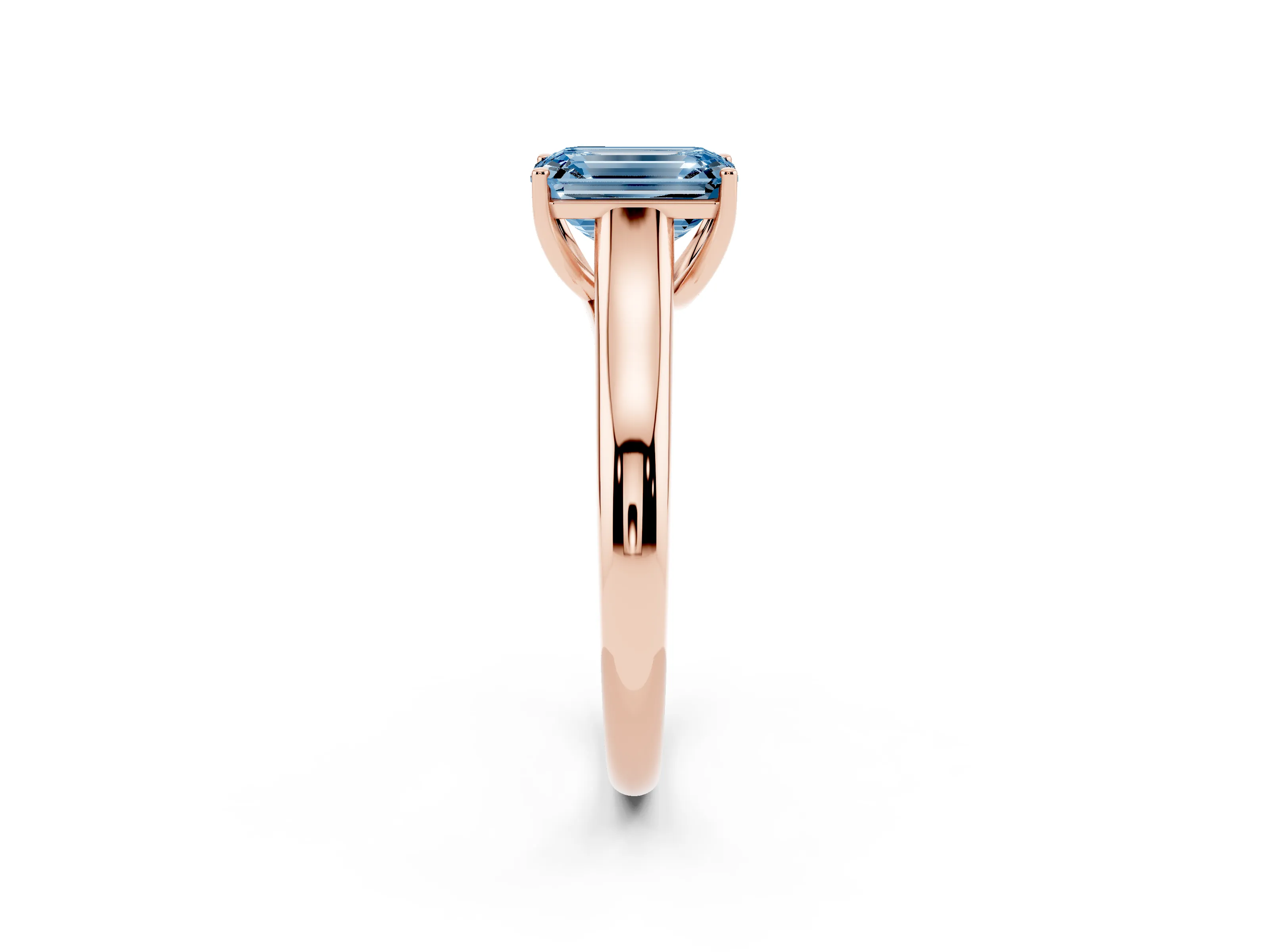 Fancy Blue Emerald Cut Diamond Solitaire Engagement Ring Set in Rose gold with Subtly Tapered Band and Prong Setting