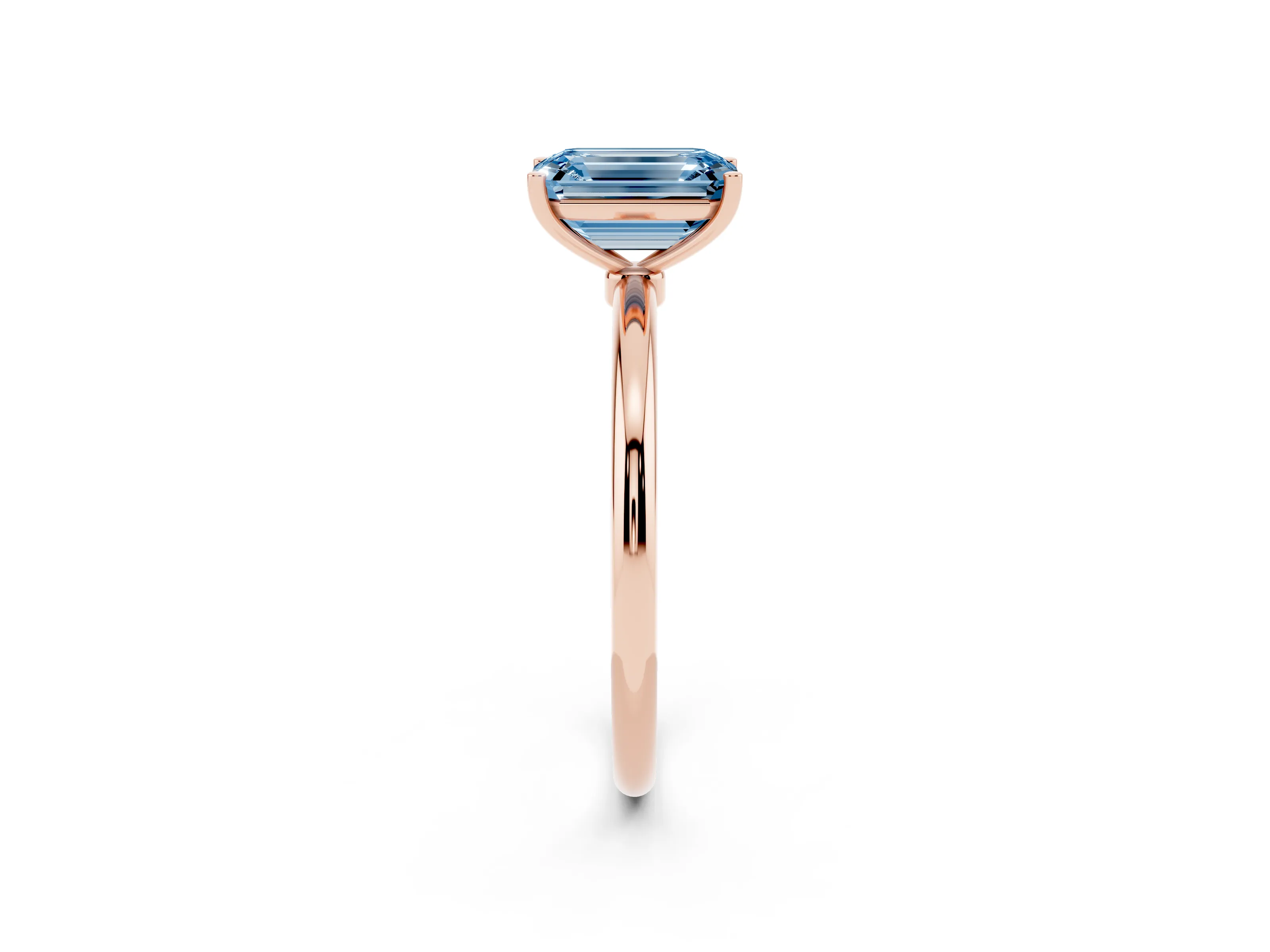 Fancy Blue Emerald Cut Diamond Solitaire Engagement Ring Set in Rose gold with Thin Band and Prong Setting