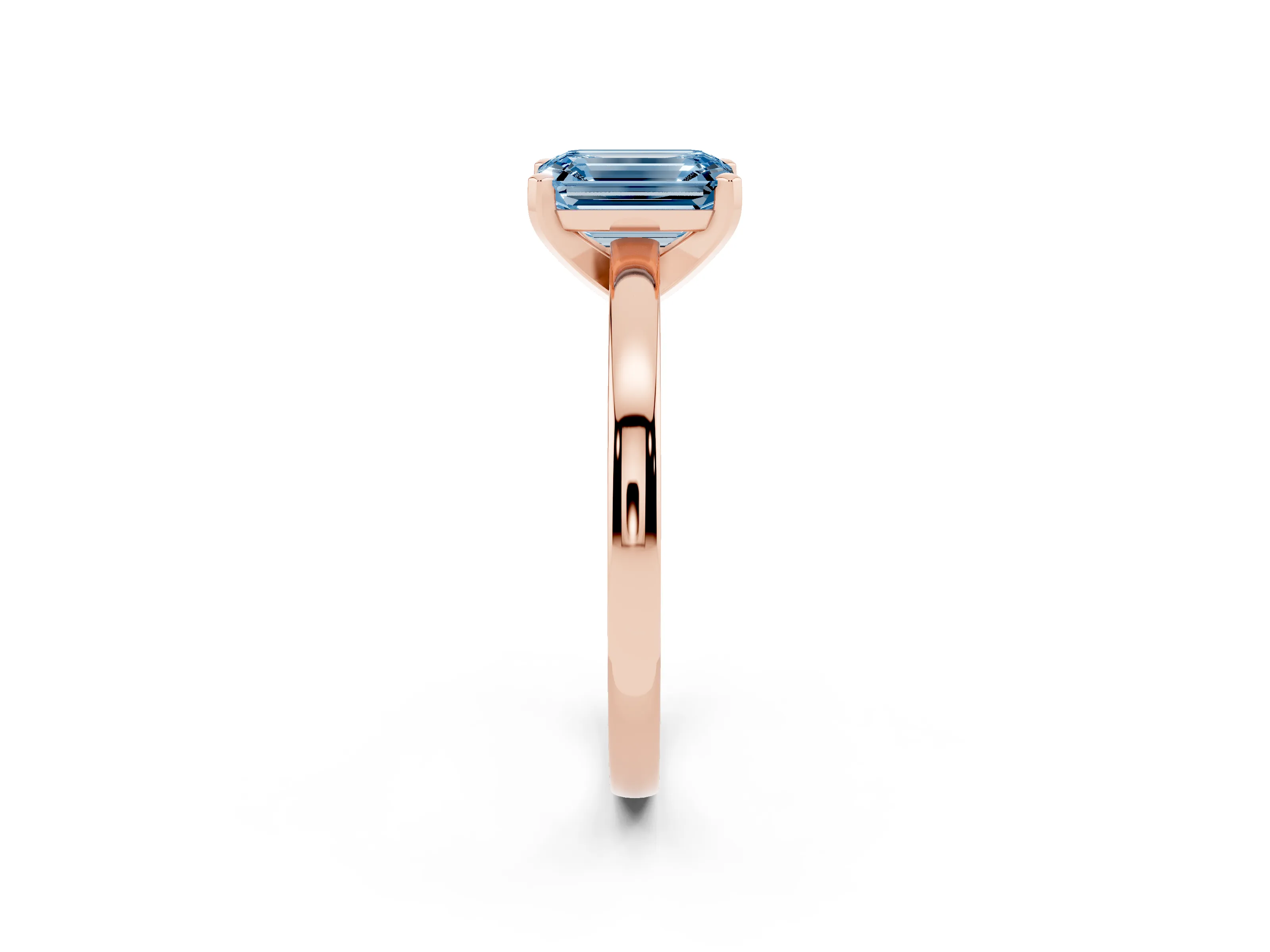 Fancy Blue Emerald Cut Diamond Solitaire Engagement Ring Set in Rose gold with Prong Setting on a Classic Band