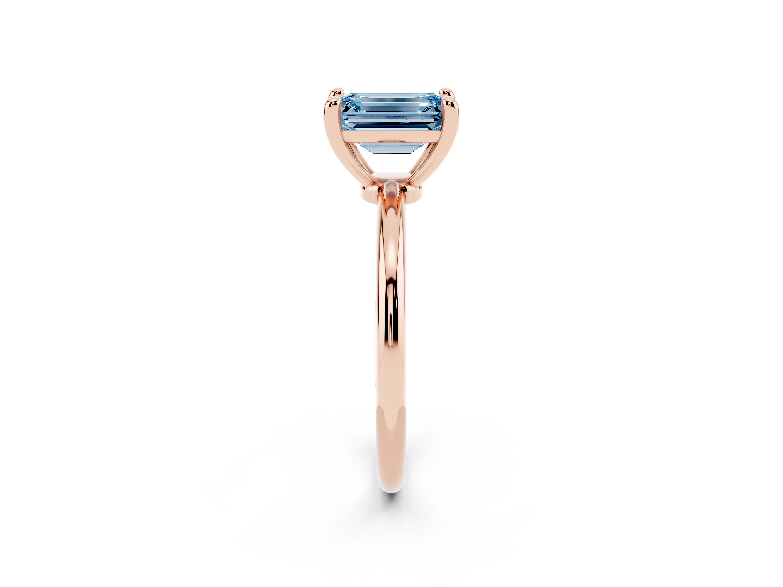 Fancy Blue Emerald Cut Diamond Solitaire Ring Set in Rose gold with Secure Prong Setting on a Classic Band