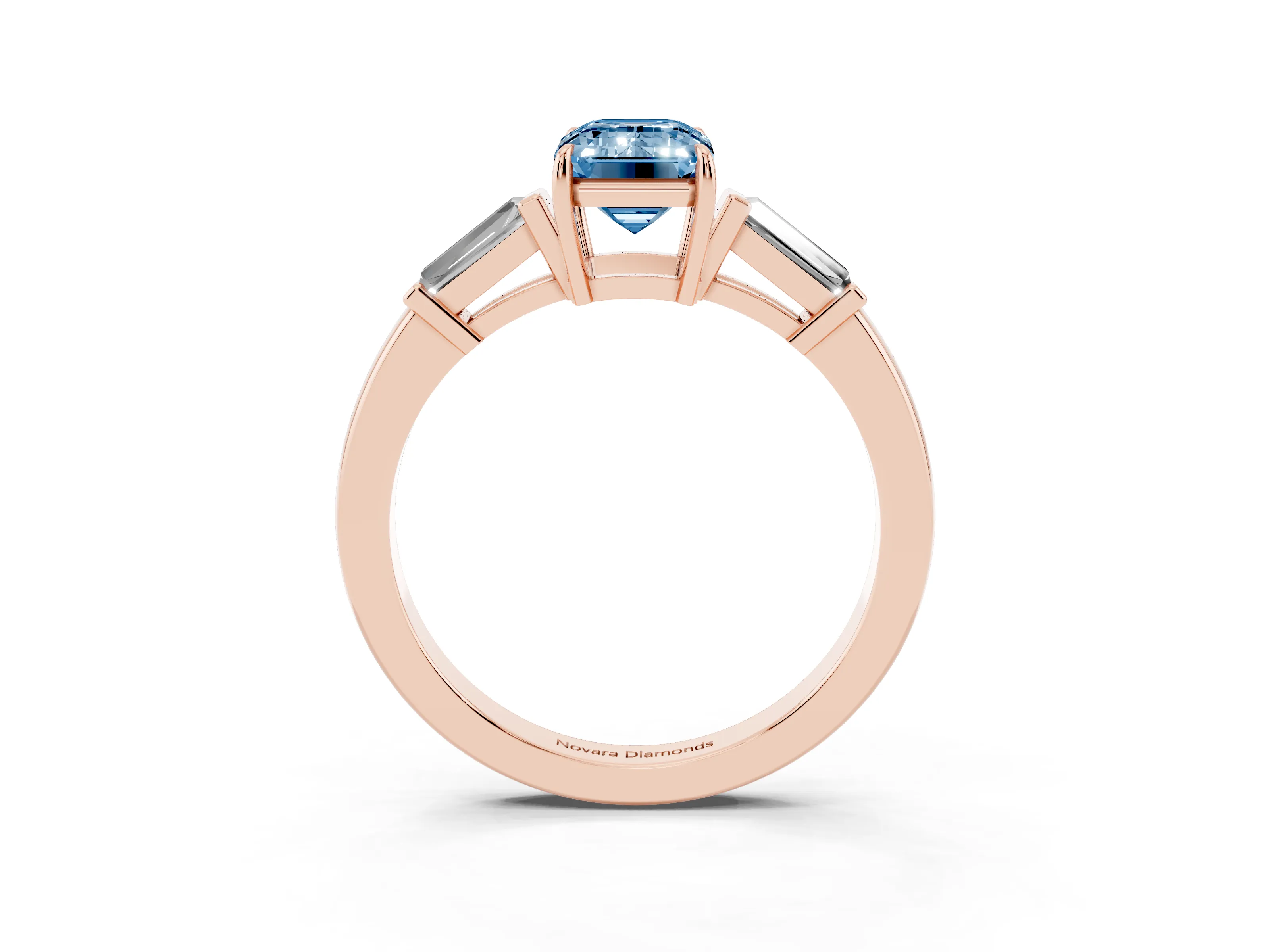 Fancy Blue Emerald Cut Diamond Three-Stone Ring Set in Rose gold with Tapered Baguette Side Stones and Prong Setting