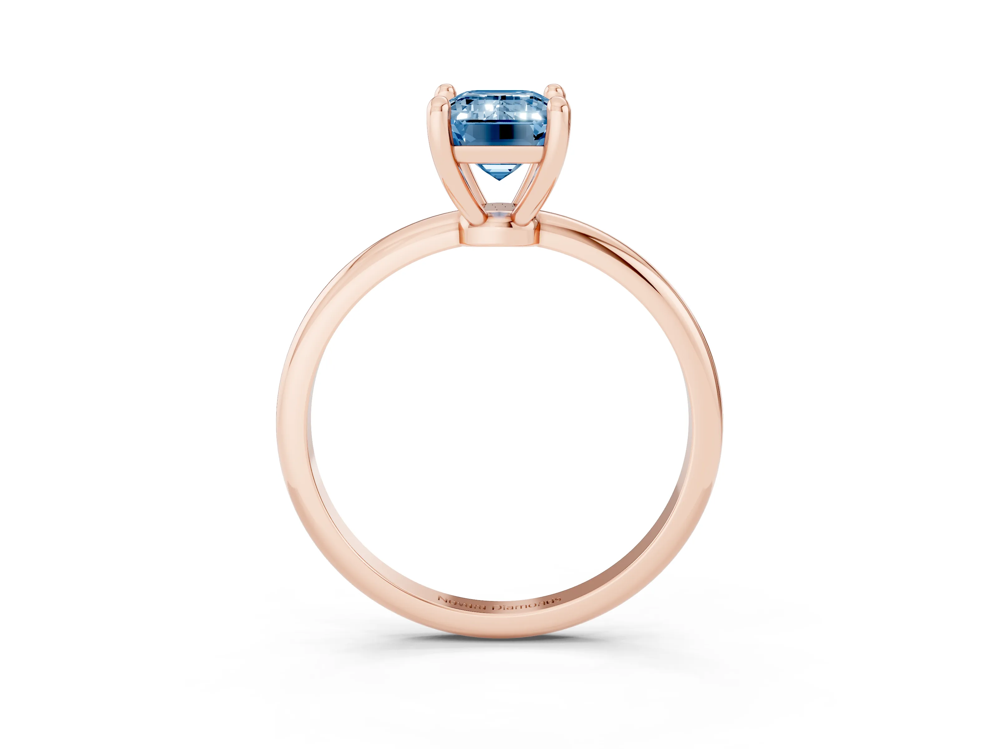 Fancy Blue Emerald Cut Diamond Solitaire Ring Set in Rose gold with Secure Prong Setting on a Classic Band