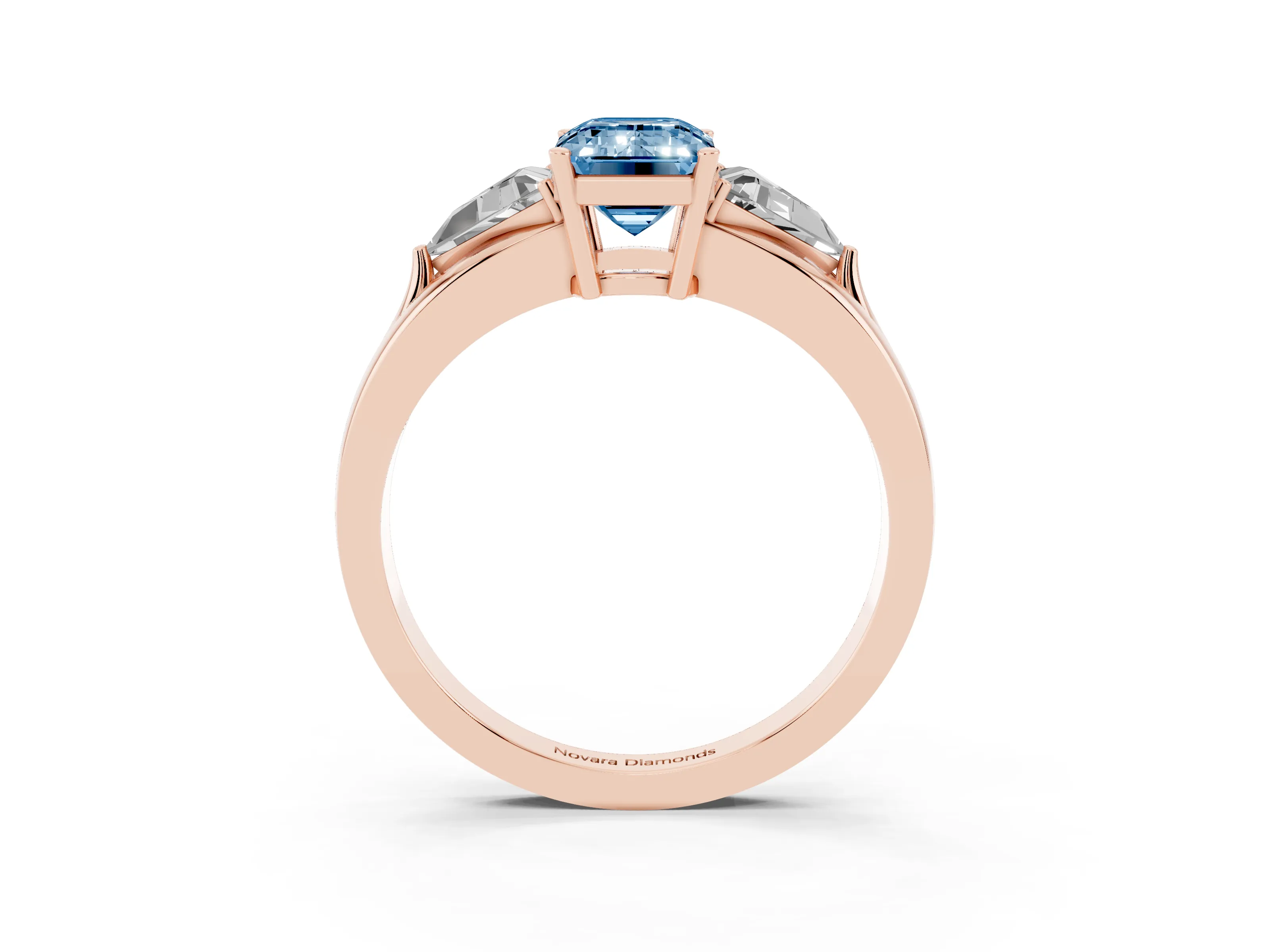 Fancy Blue Emerald Cut Diamond Three-Stone Ring Set in Rose gold with Trillion Side Stones and Split Shank