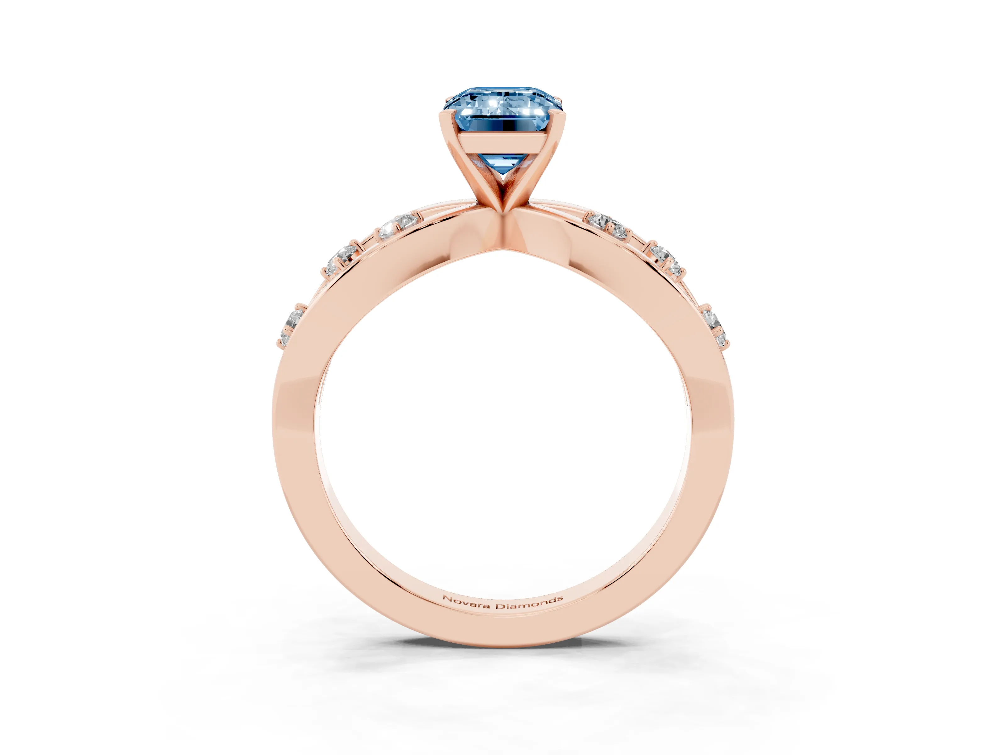 Fancy Blue Emerald Cut Diamond Solitaire Ring Set in Rose gold with Side Stones on Criss-Cross Band and Prong Setting