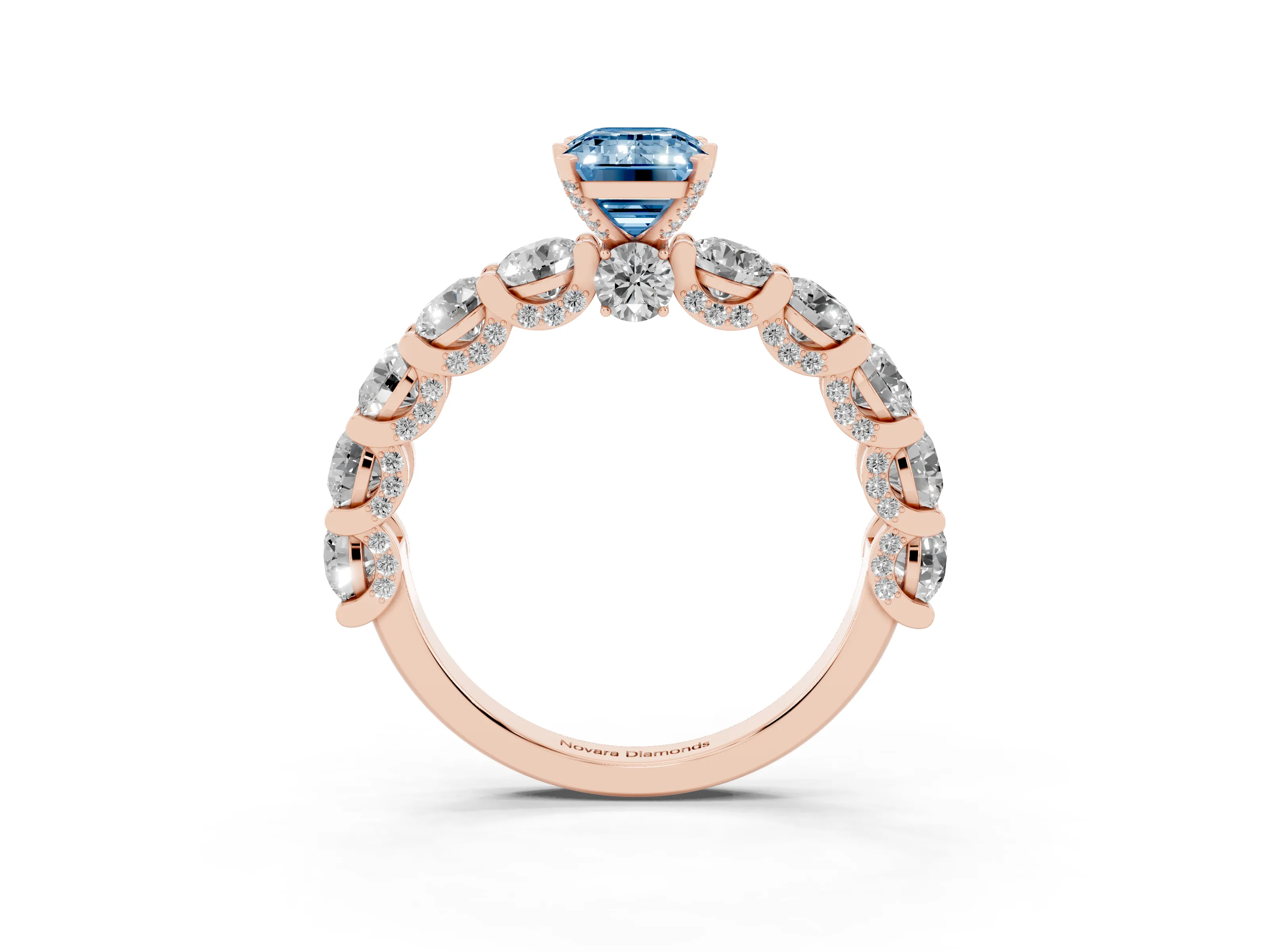 Fancy Blue Emerald Cut Diamond Side Stone Ring Set in Rose gold with Alternating Round and Oval Side Stones