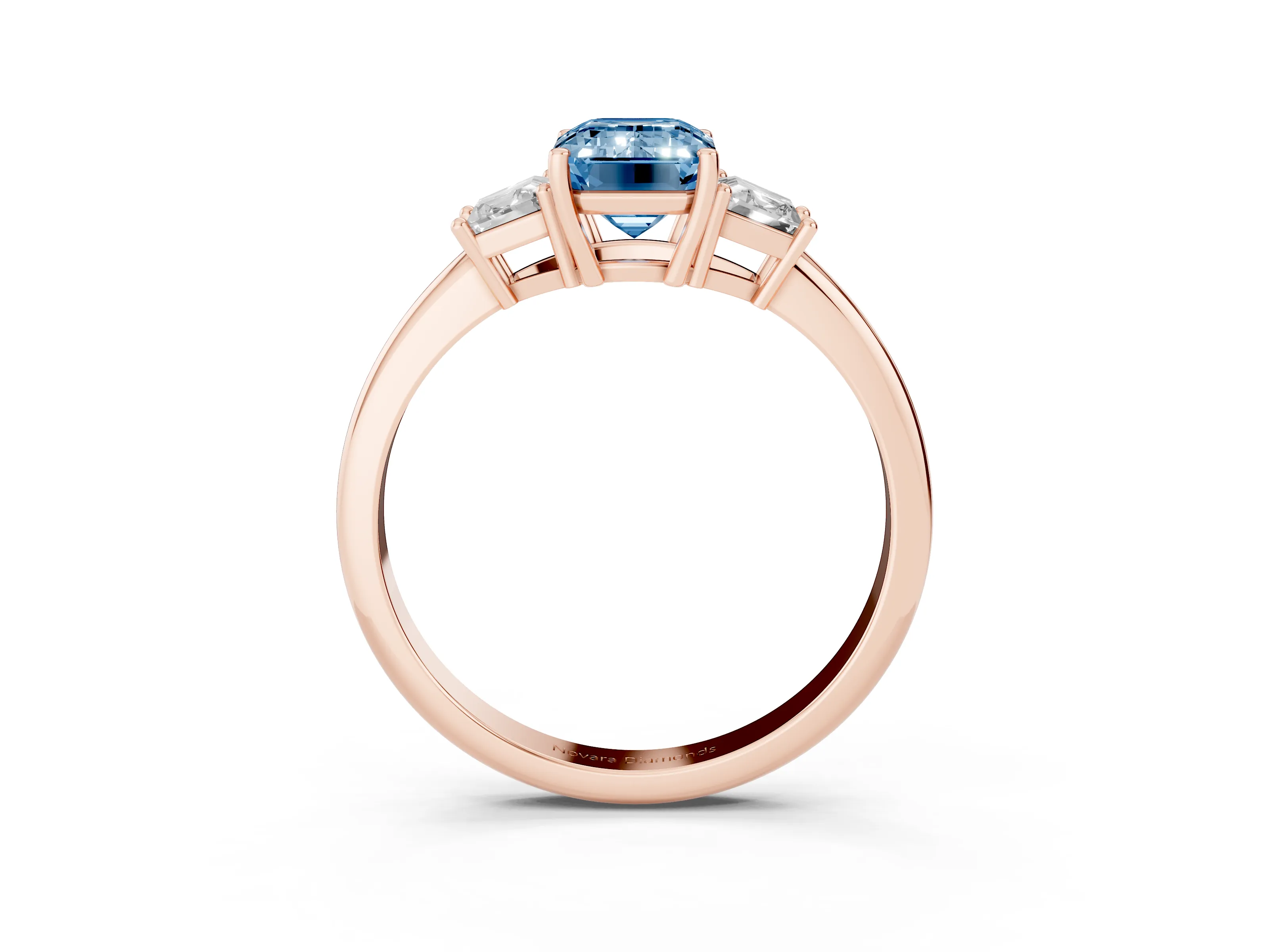 Fancy Blue Emerald Cut Diamond Three-Stone Ring Set in Rose gold with Trapezoid Side Stones and Prong Setting